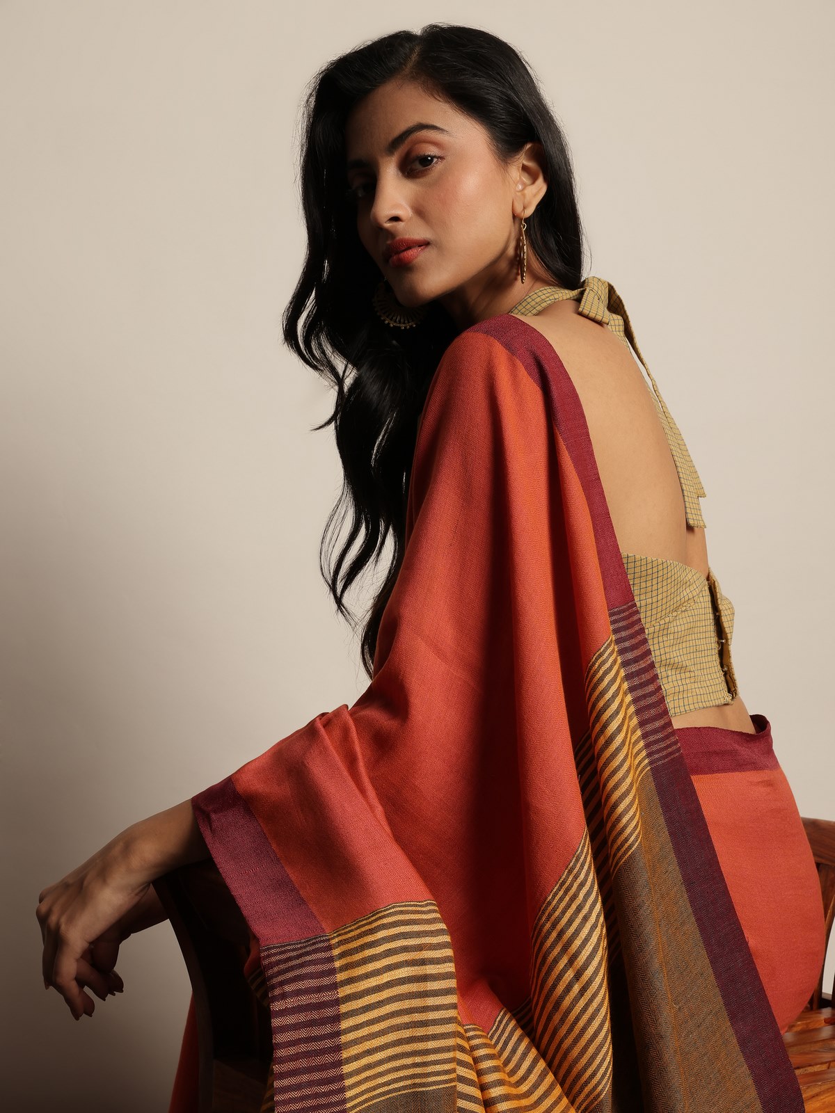 Side view of grey linen saree highlighting texture and airy weave.