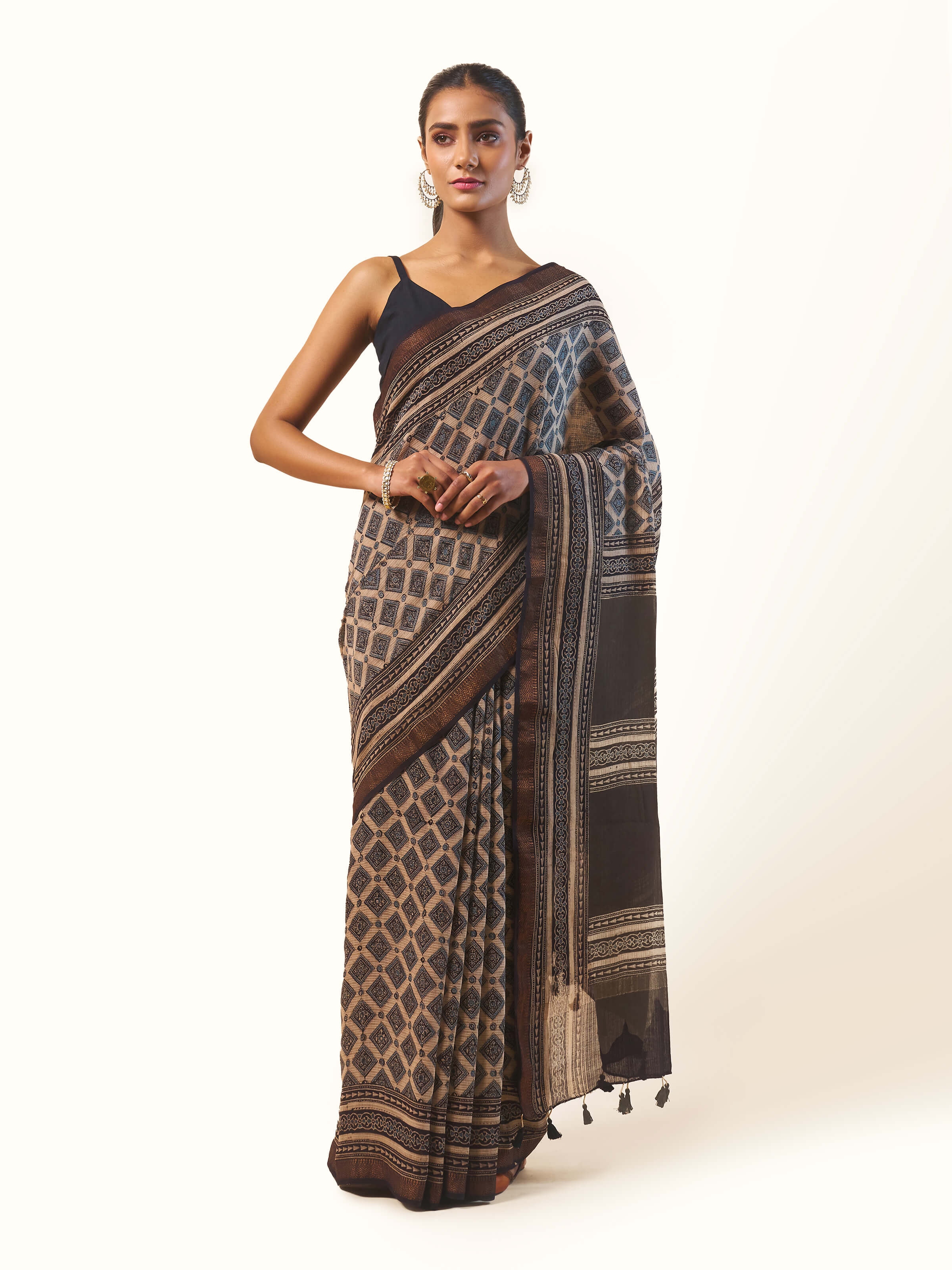 Front view of black Maheshwari Ajrakh block printed saree with intricate geometric patterns