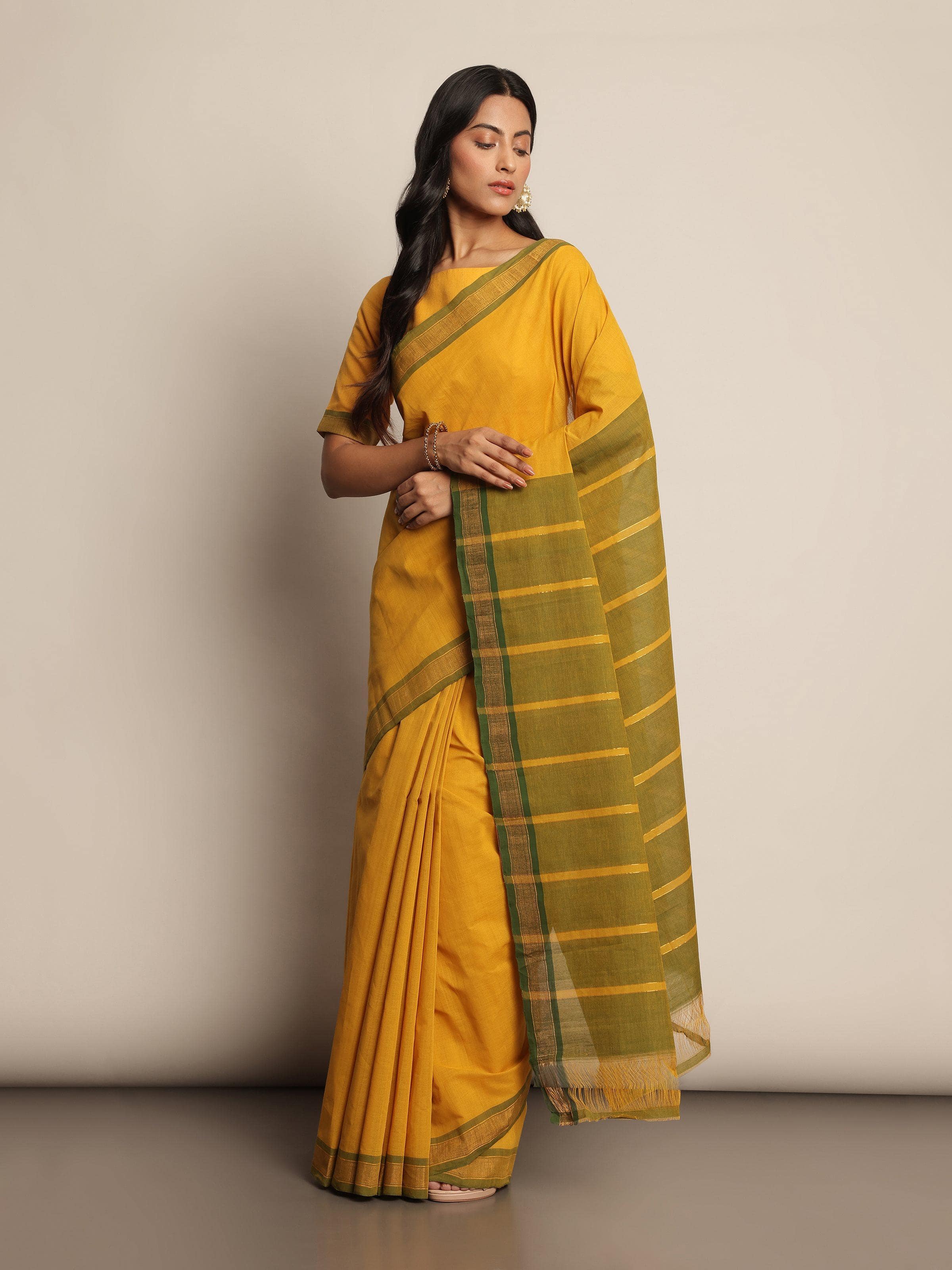 Lifestyle image of Mustard Cotton Mangalgiri Saree draped with traditional pleats and pallu.