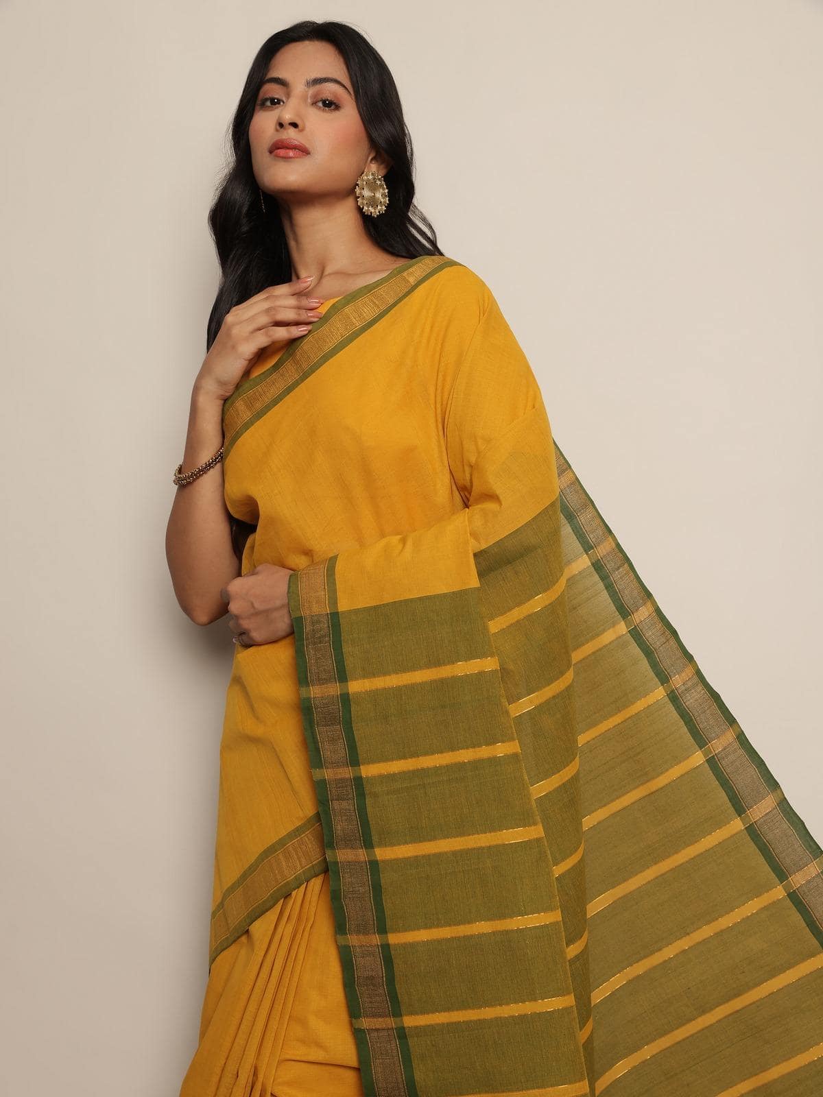 Close-up angled shot of Mustard Cotton Mangalgiri Saree highlighting cotton texture and weaving.