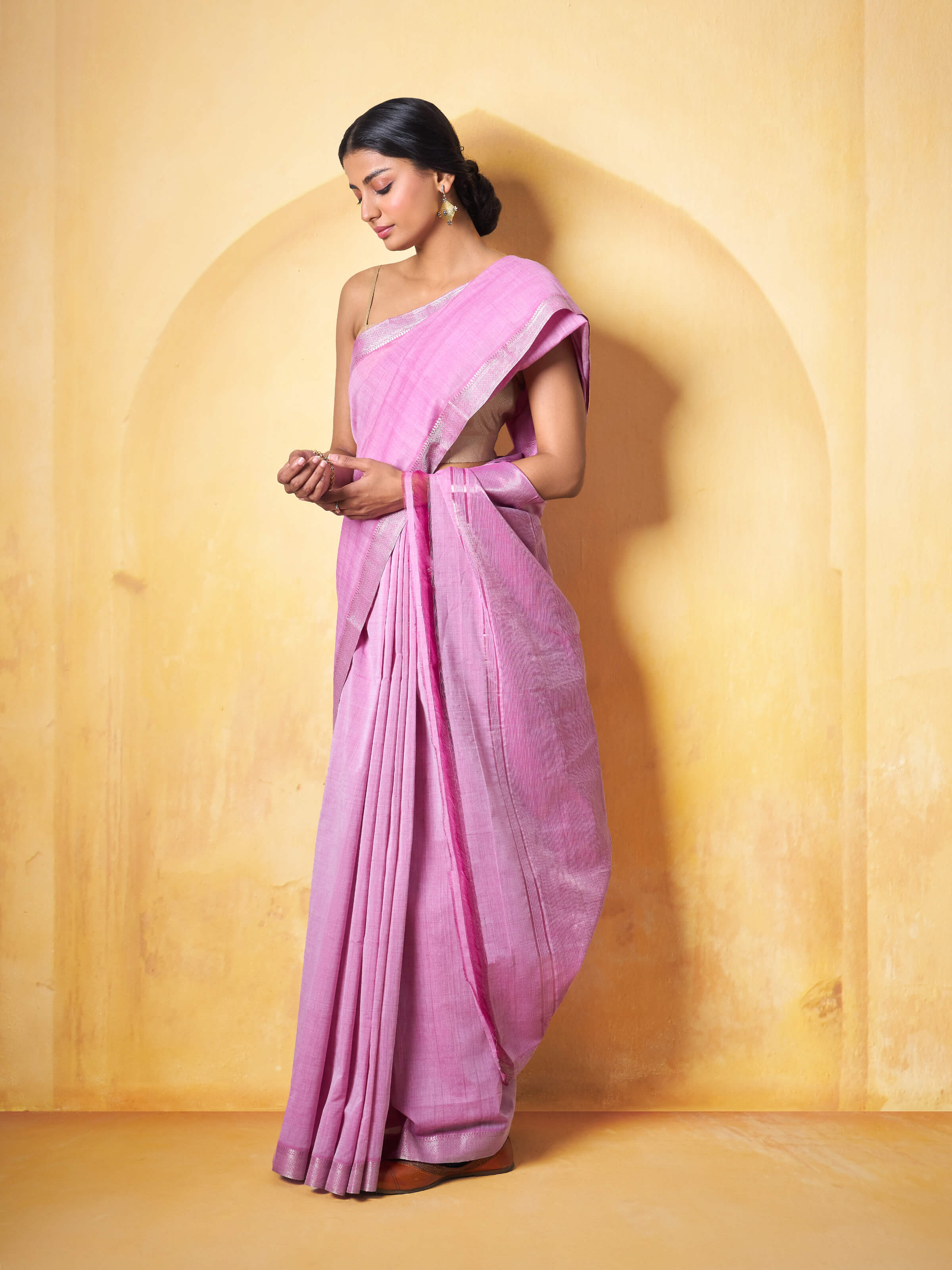 Lifestyle view of pink Mangalgiri saree draped elegantly with a complementary blouse