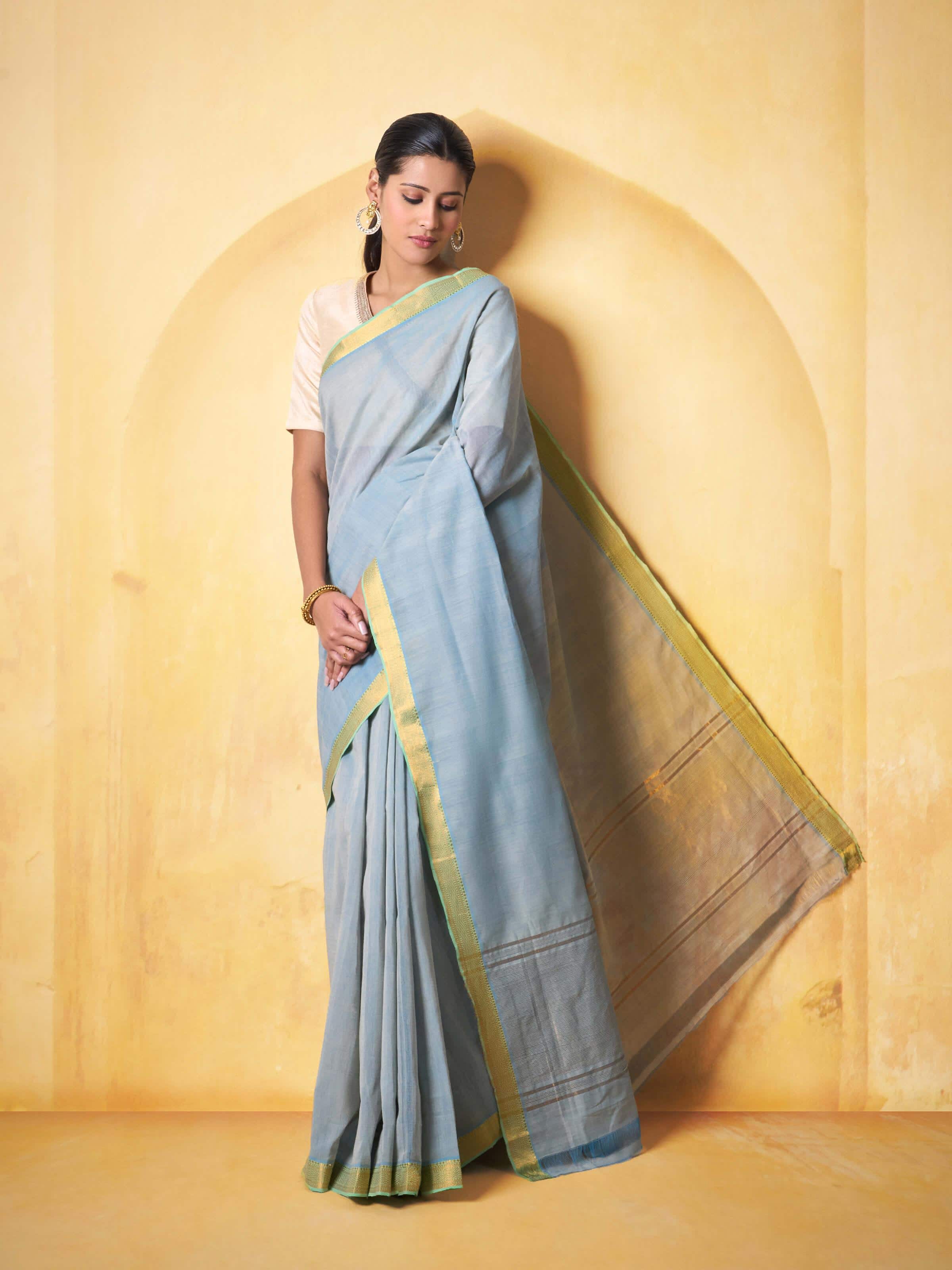 Lifestyle view of Light Blue Cotton Mangalgiri Saree draped elegantly on model.