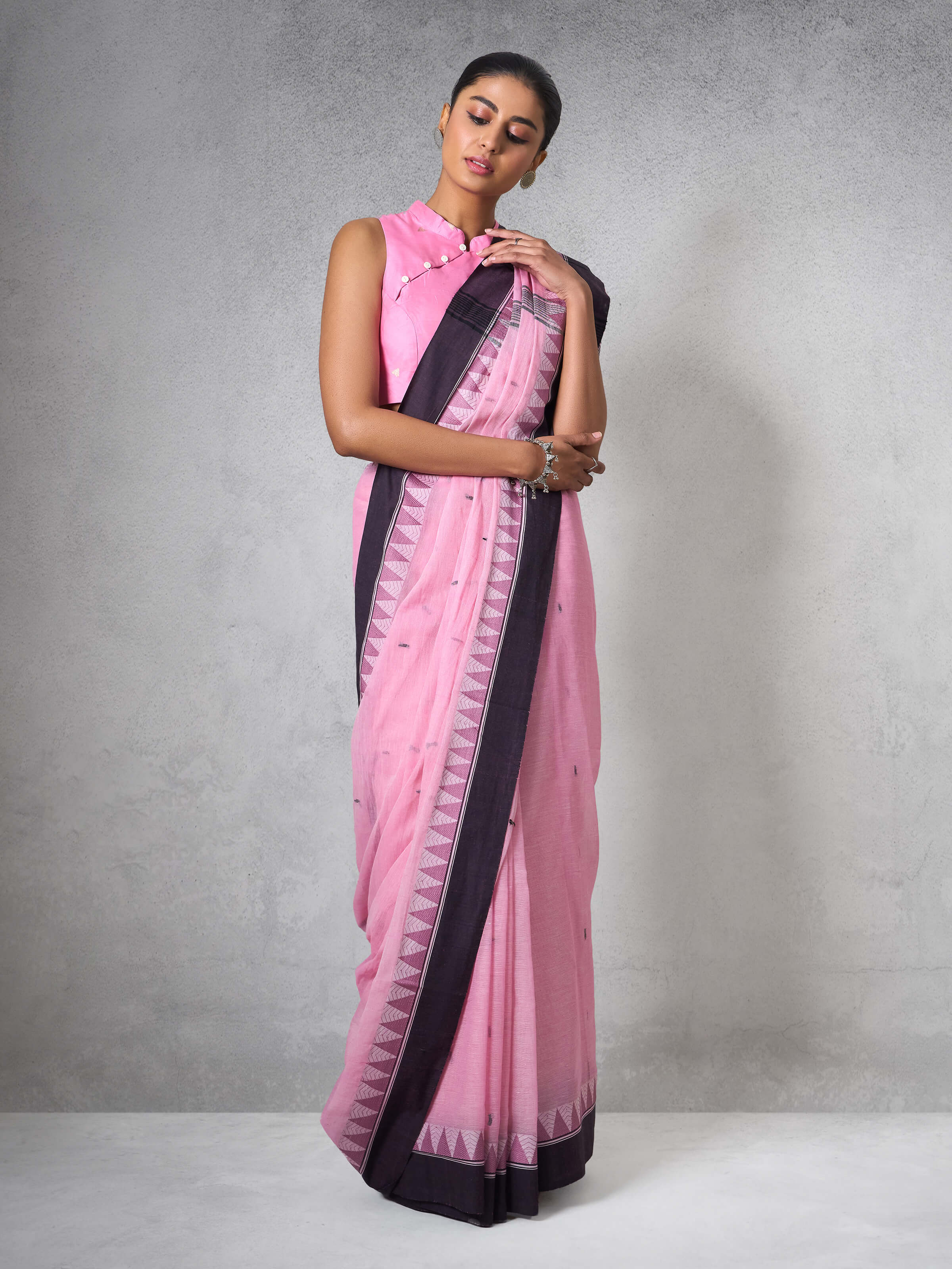 Lifestyle image of Pink Cotton Bengal Saree worn with matching blouse