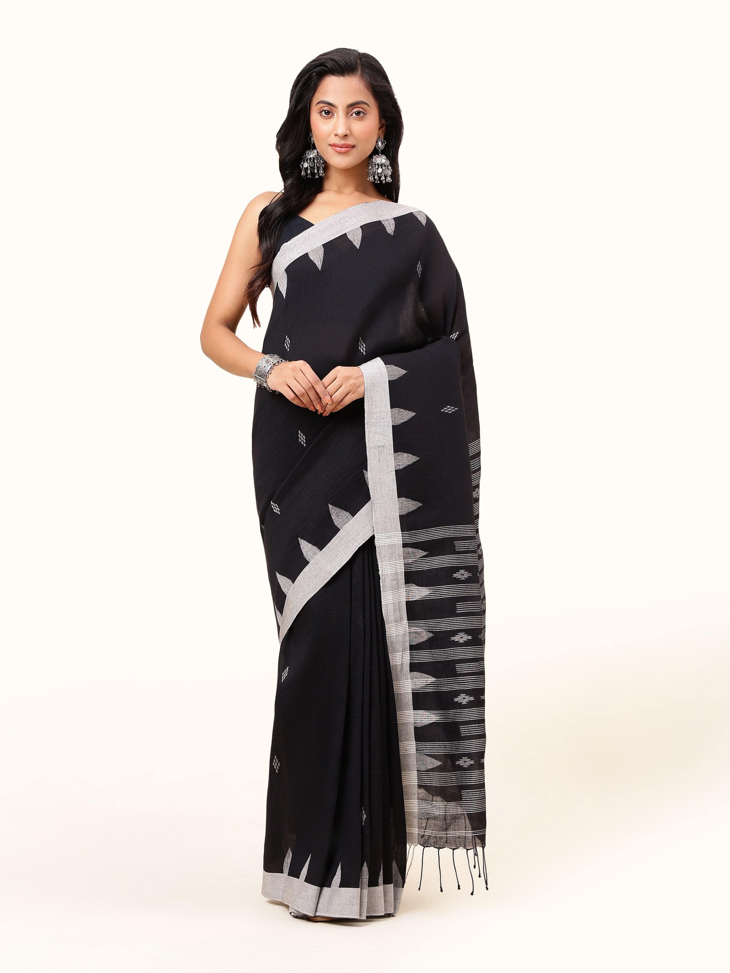 Front view of the refined black linen cotton saree, showcasing its simple elegance and rich texture.