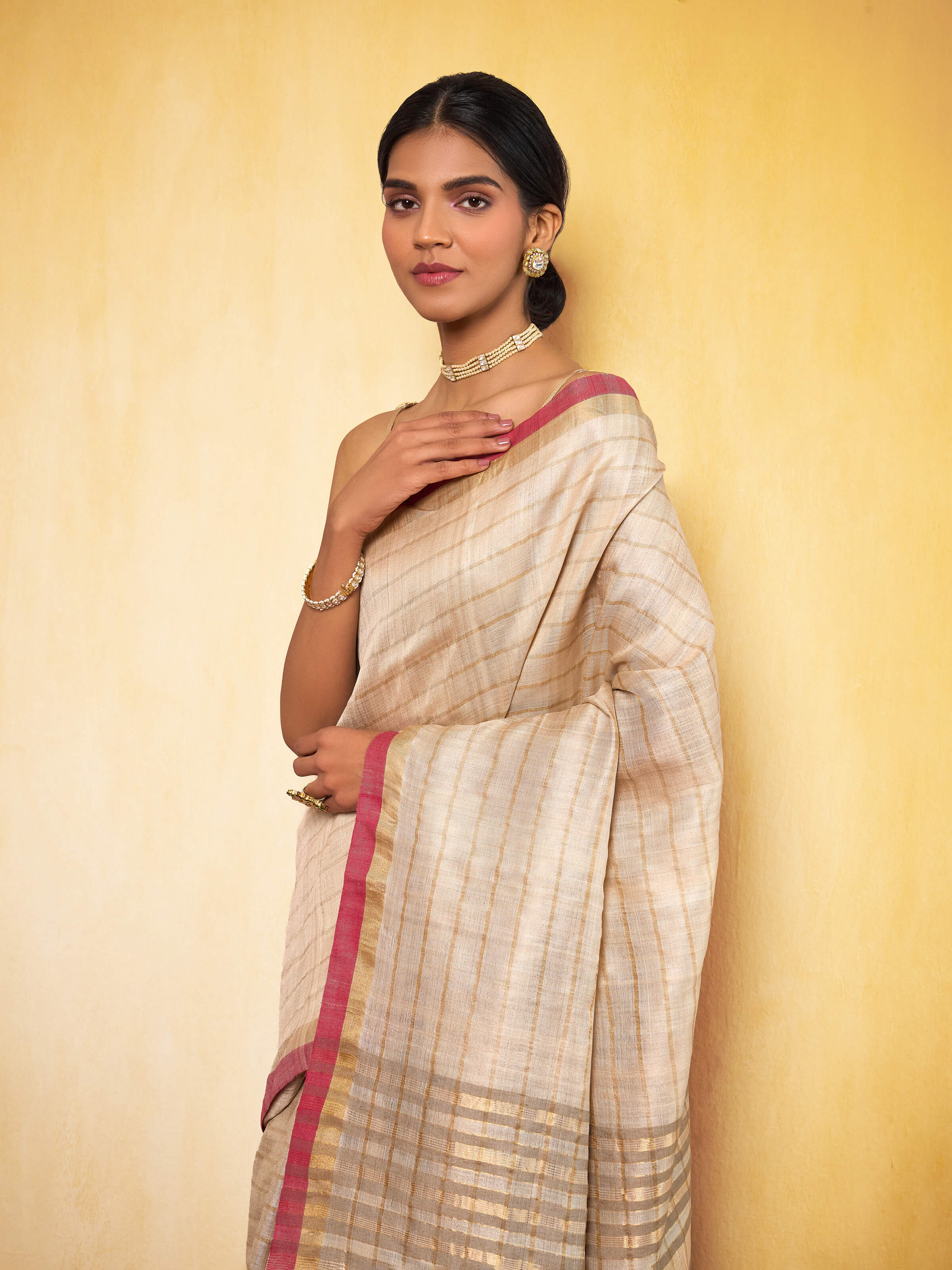 Aerial view highlighting zari detailing and soft silk weave.