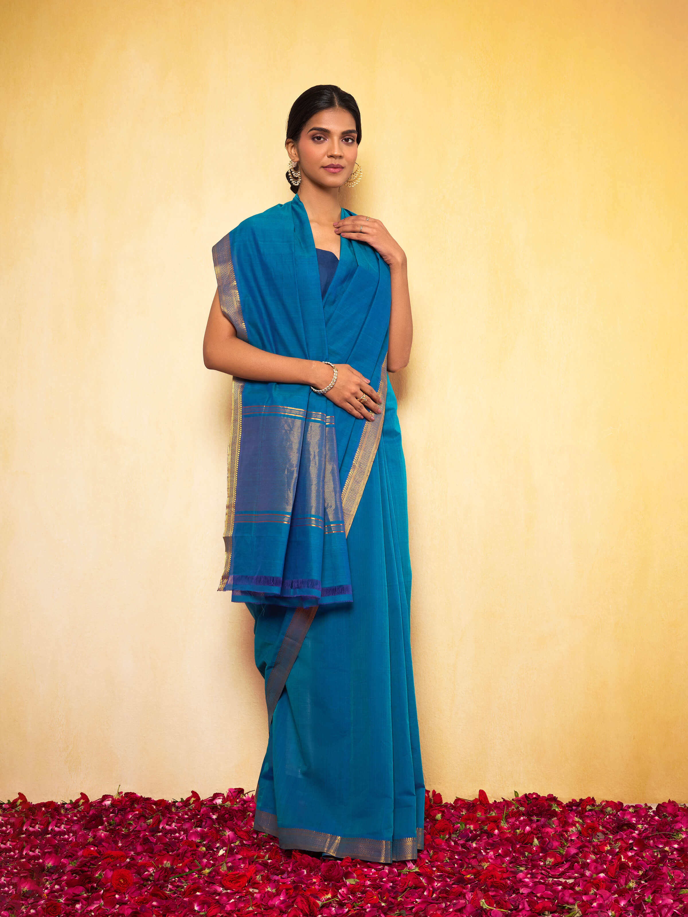 Lifestyle shot highlighting the interplay of the deep indigo and the rich golden border.