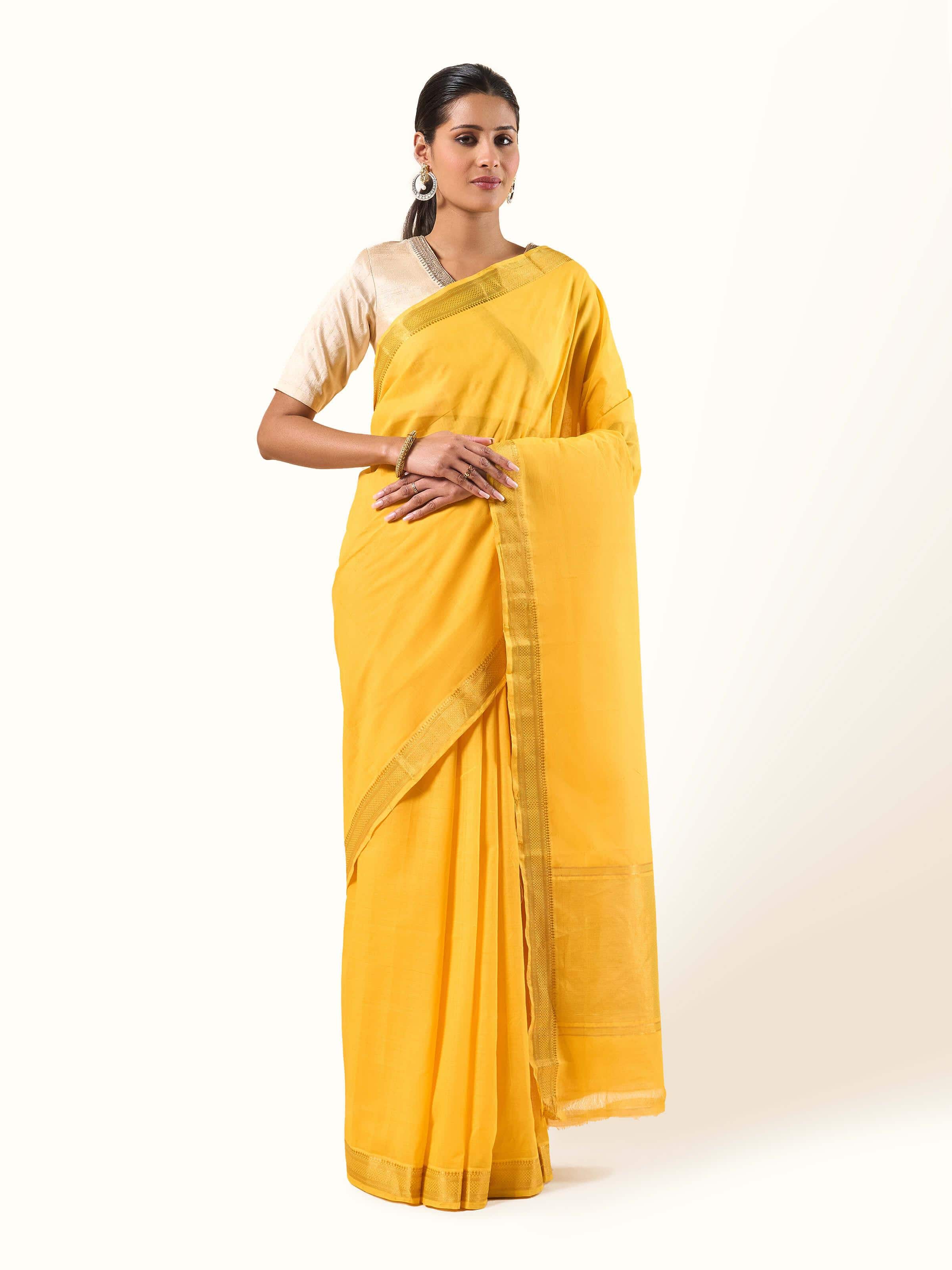 Front view of yellow cotton Mangalgiri saree with simple woven border