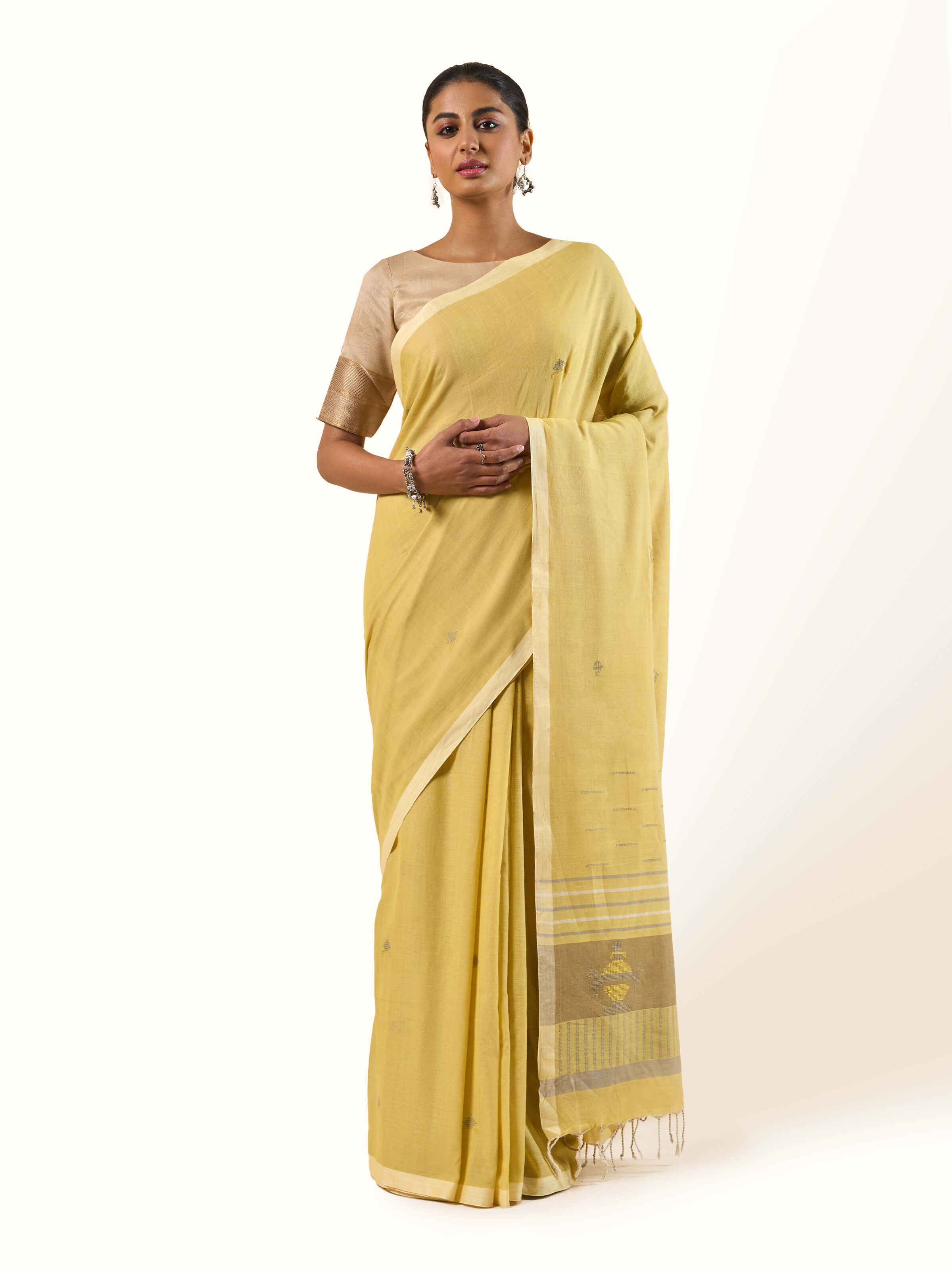 Front view of Light Yellow Cotton Extra-weft Saree with delicate handwoven texture by Swadesh.