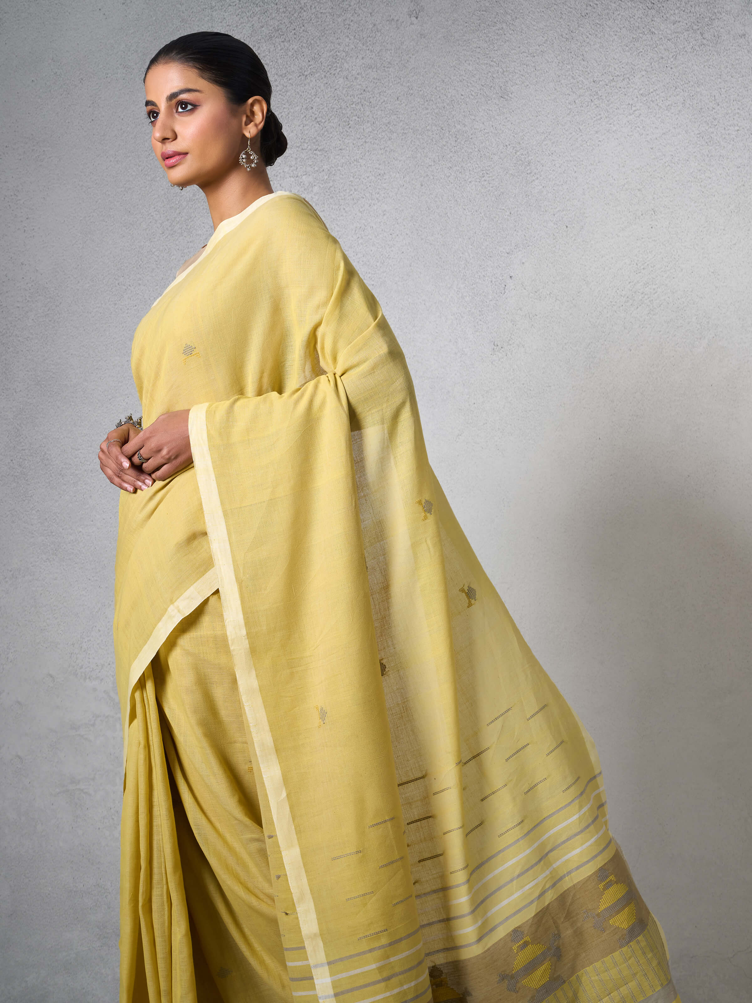 Close-up detail of Light Yellow Cotton Extra-weft Saree showcasing fine weave and pastel tone.