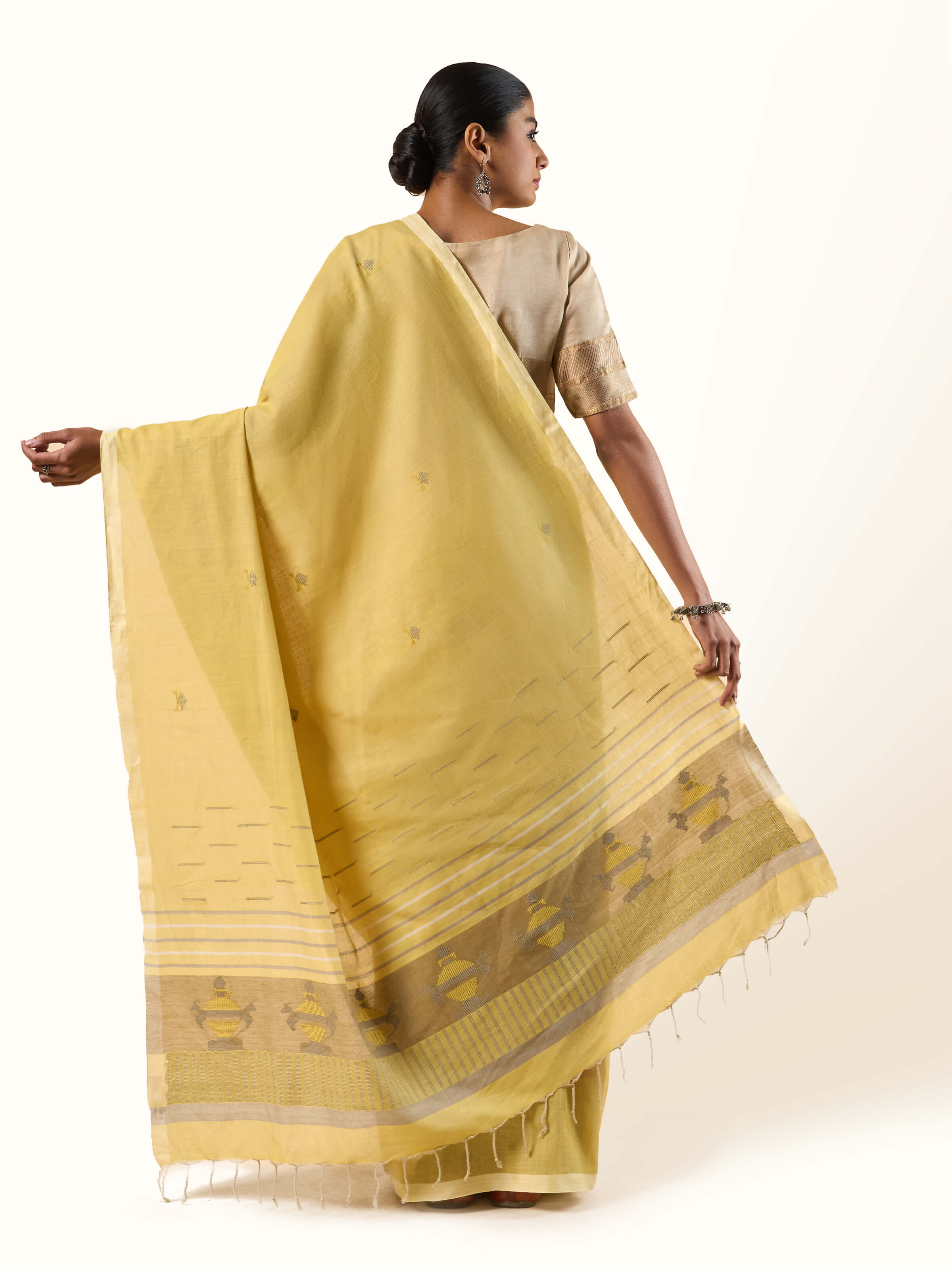 Back view of Light Yellow Cotton Extra-weft Saree revealing pure cotton handloom artistry.