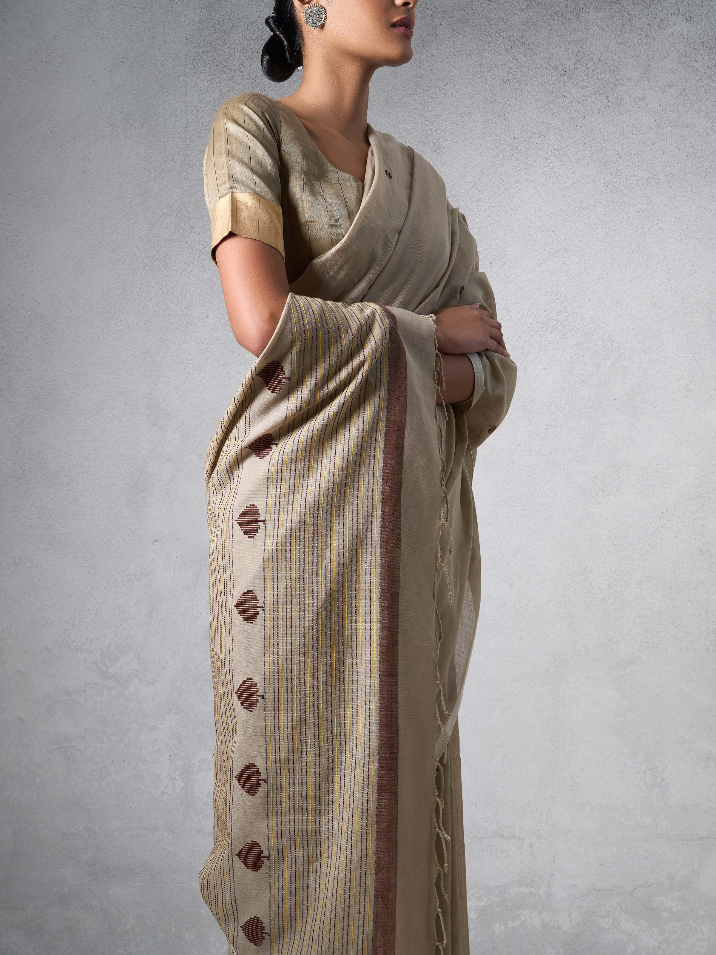 Detailed shot focusing on the weave and pattern intricacies of Cotton Extra-Weft Saree