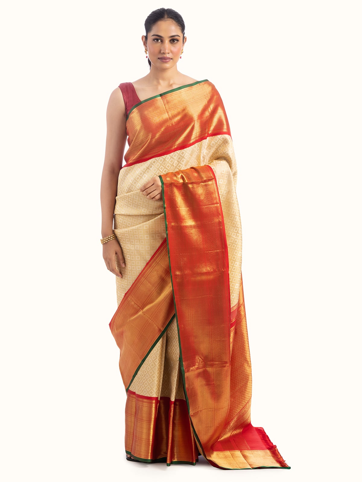 Front view showcasing the luxurious off-white silk and traditional Kancheepuram weaving.