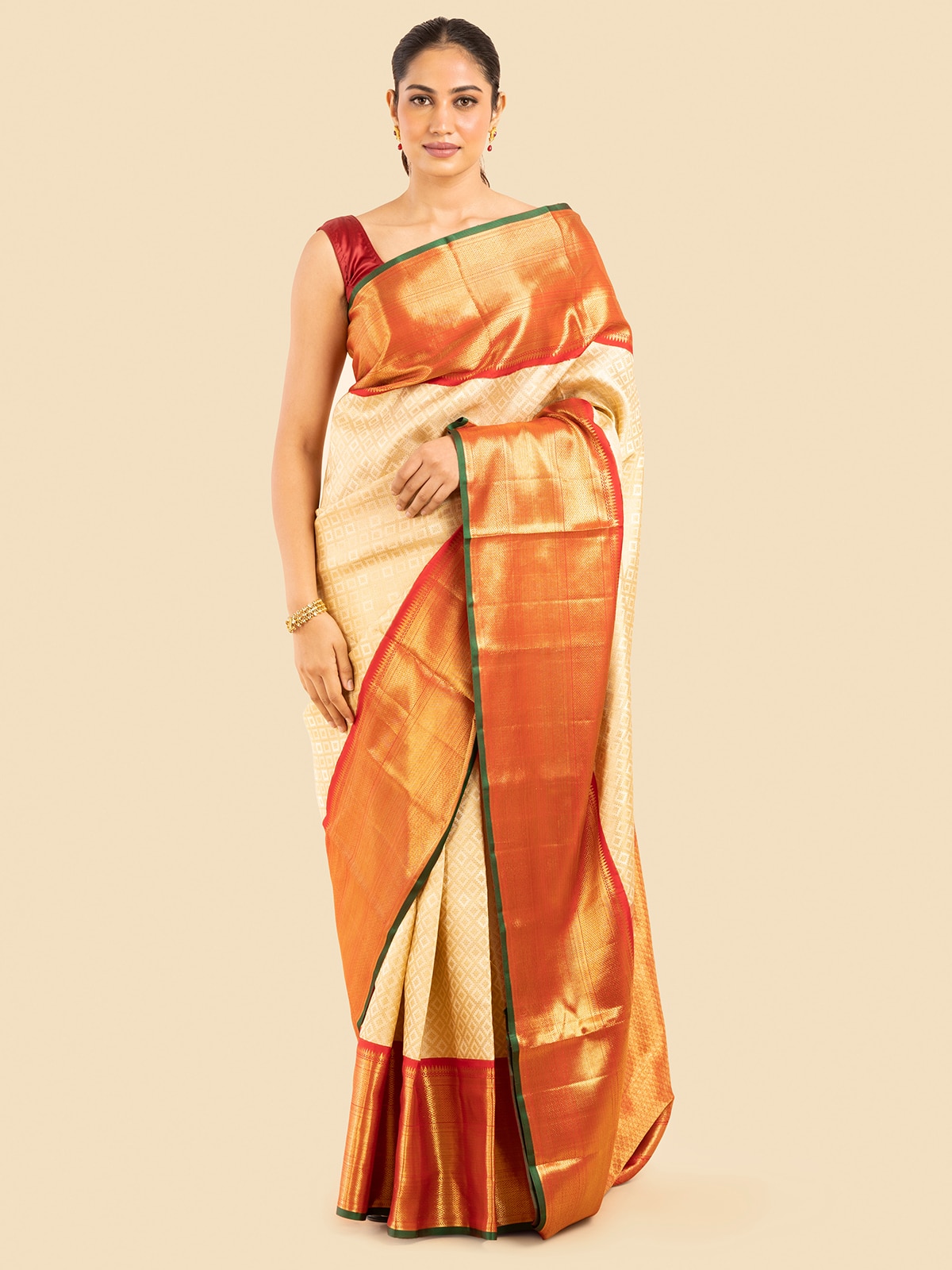 Lifestyle shot highlighting how the saree drapes beautifully for a regal look.