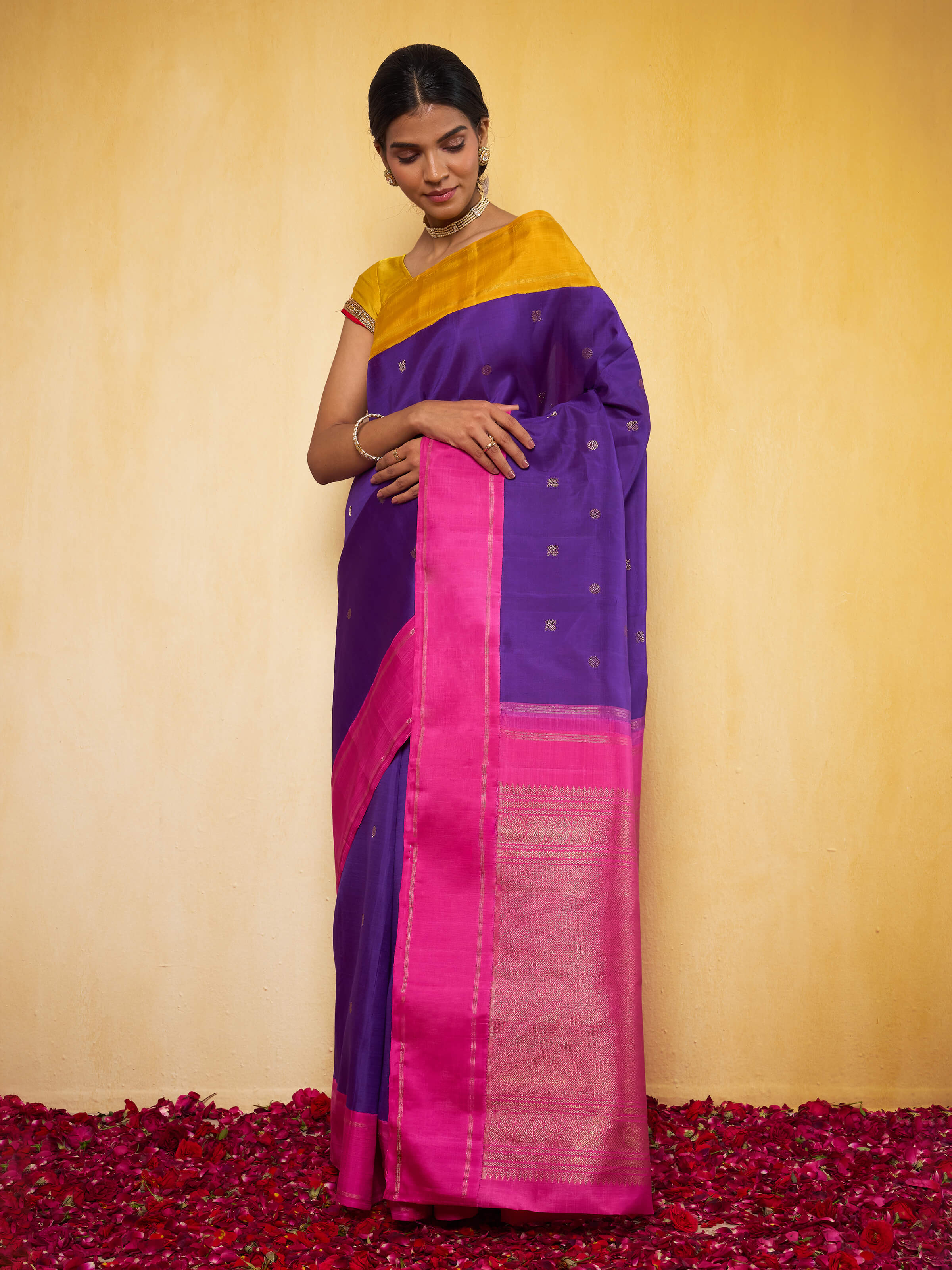 Lifestyle shot of model wearing Blue and Pink Kancheepuram Saree styled traditionally