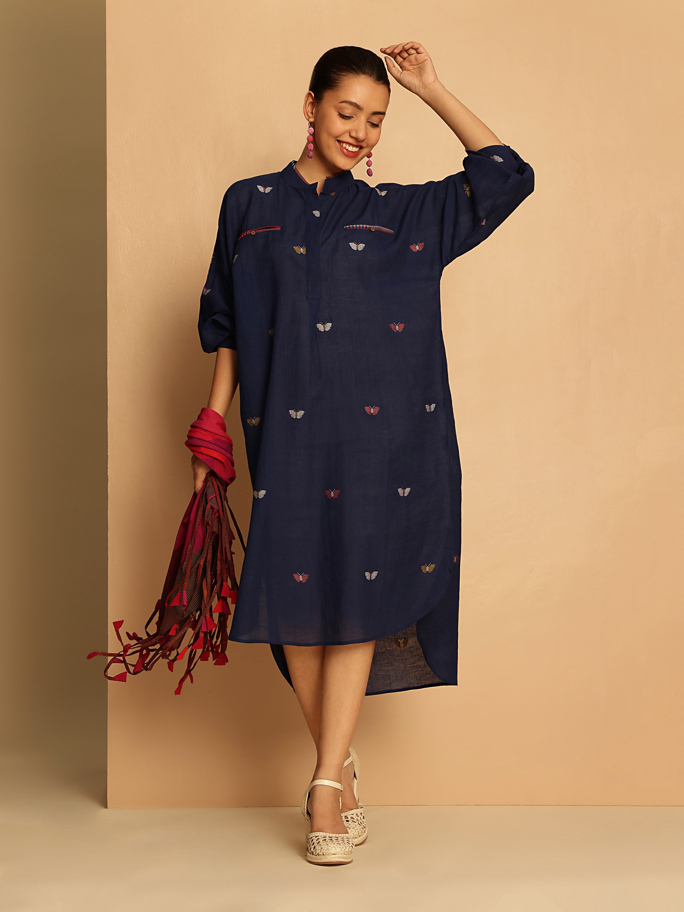 Lifestyle shot showing the contemporary take on the classic Jamdani with a long shirt silhouette.