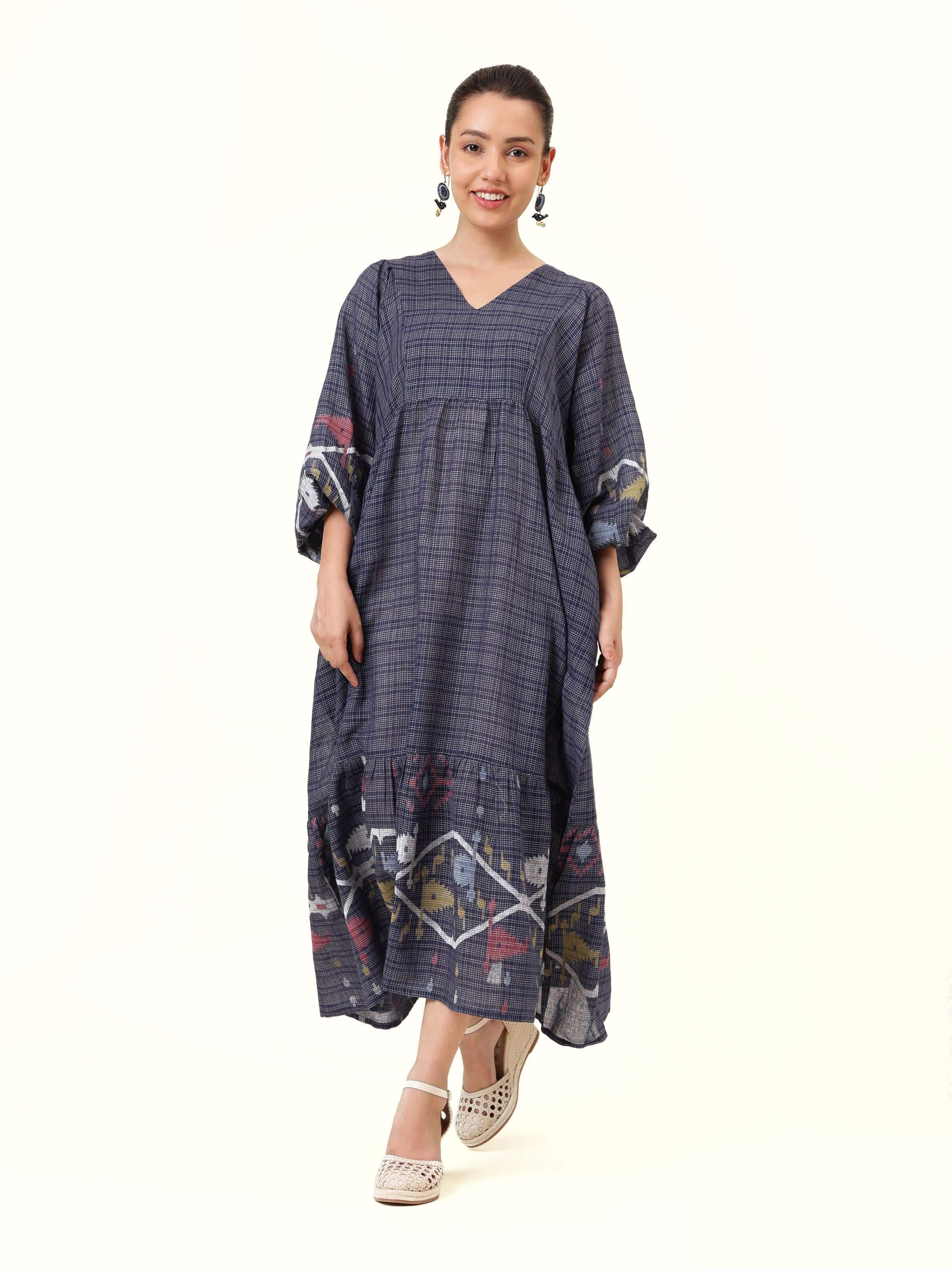 Front view of blue cotton Jamdani dress with billowy sleeves and intricate handwoven patterns