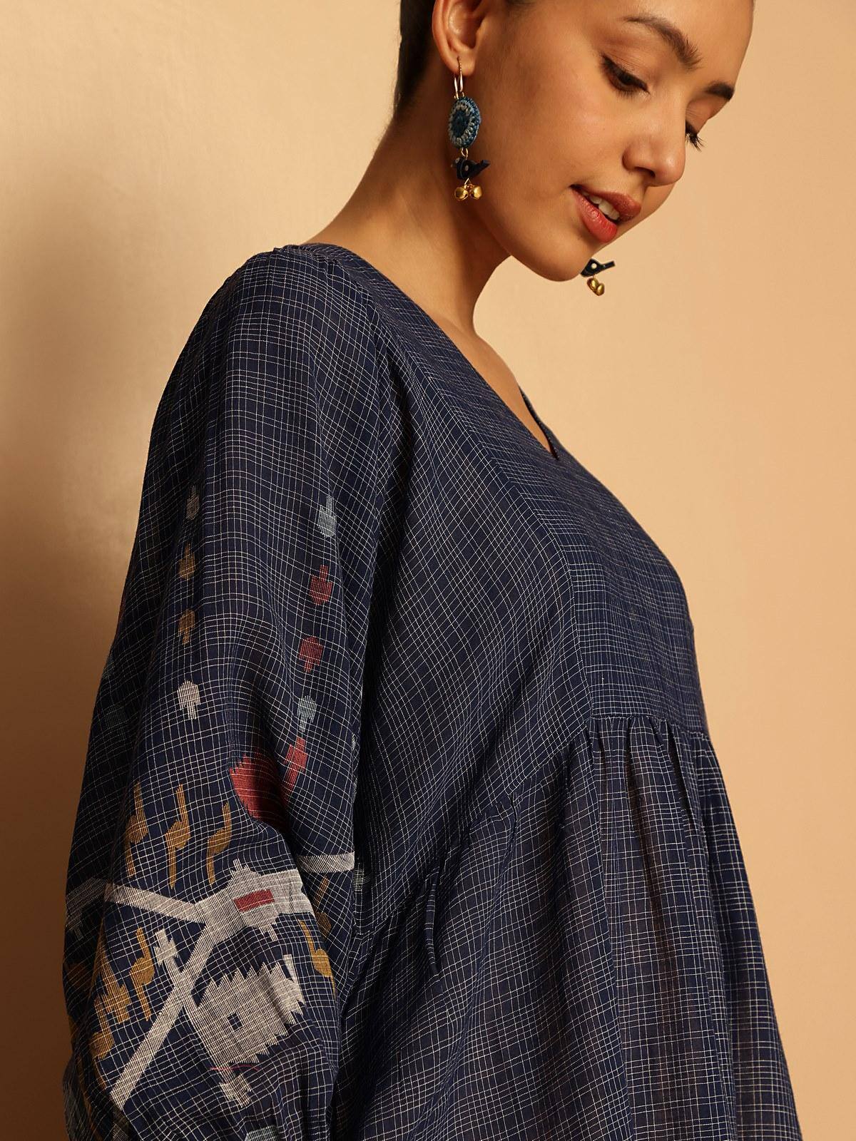 Alternate lifestyle view showing dress movement and texture of cotton Jamdani fabric