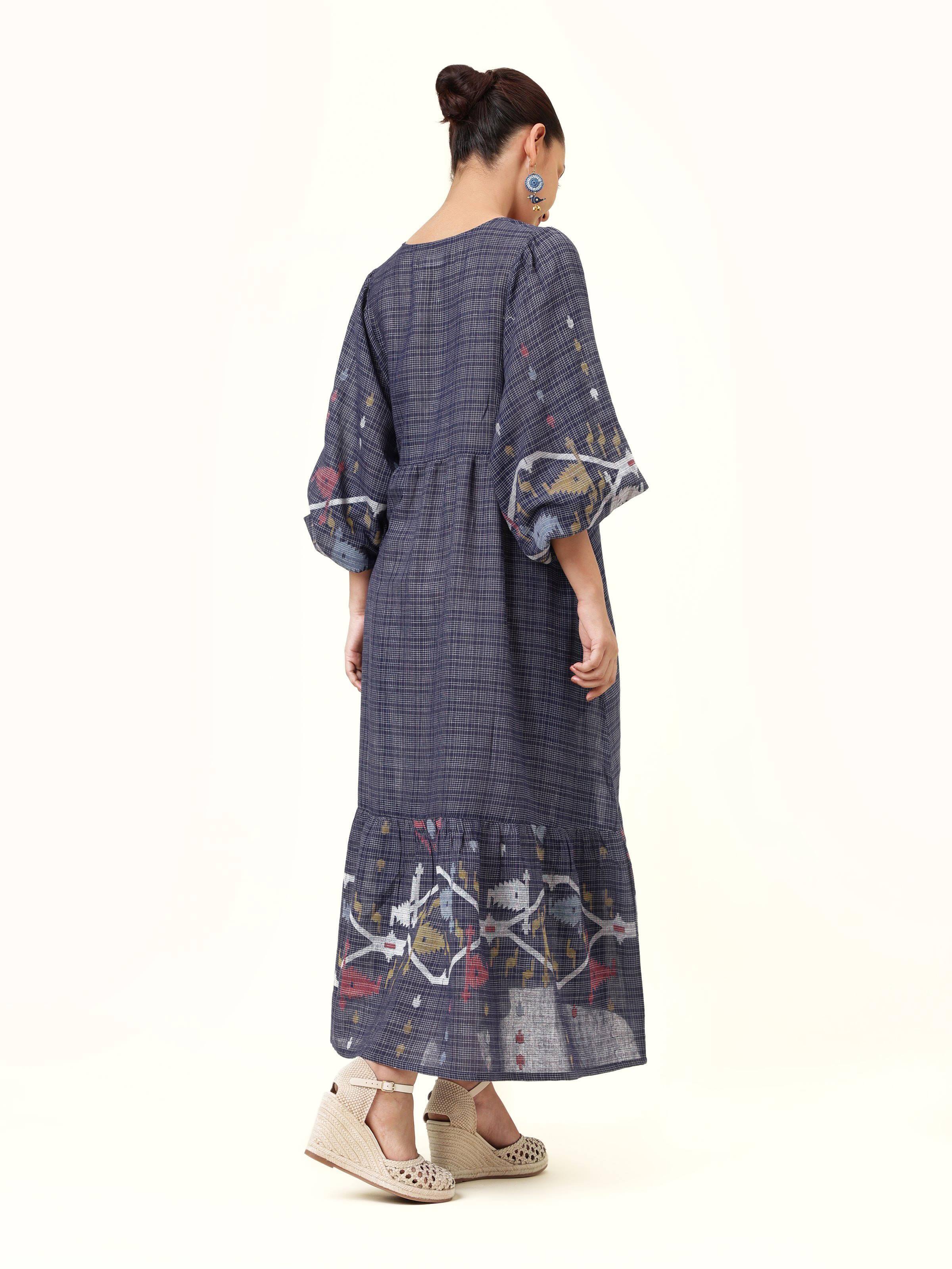 Back view of blue cotton Jamdani billowy sleeves dress displaying cut and fit