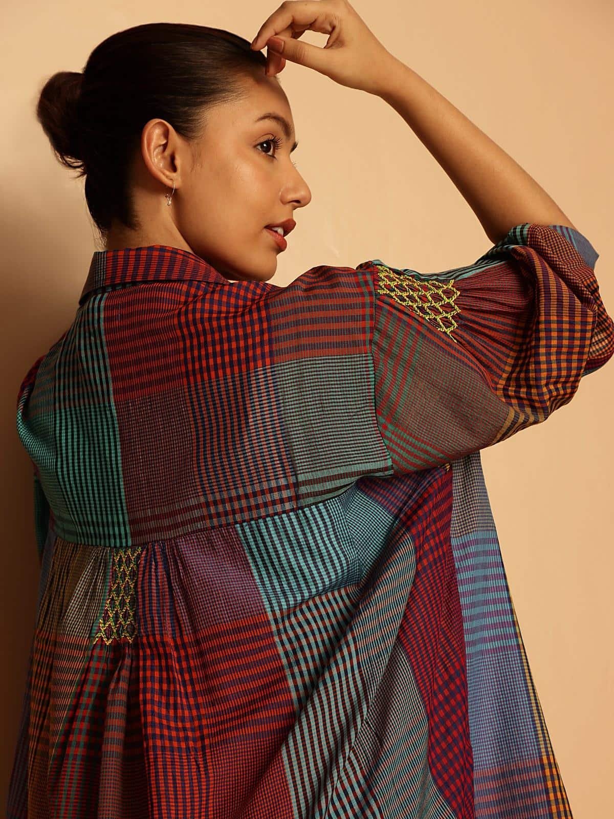 Blue silk cotton Bengal Jamdani long shirt angled view displaying intricate Jamdani motifs and shirt silhouette