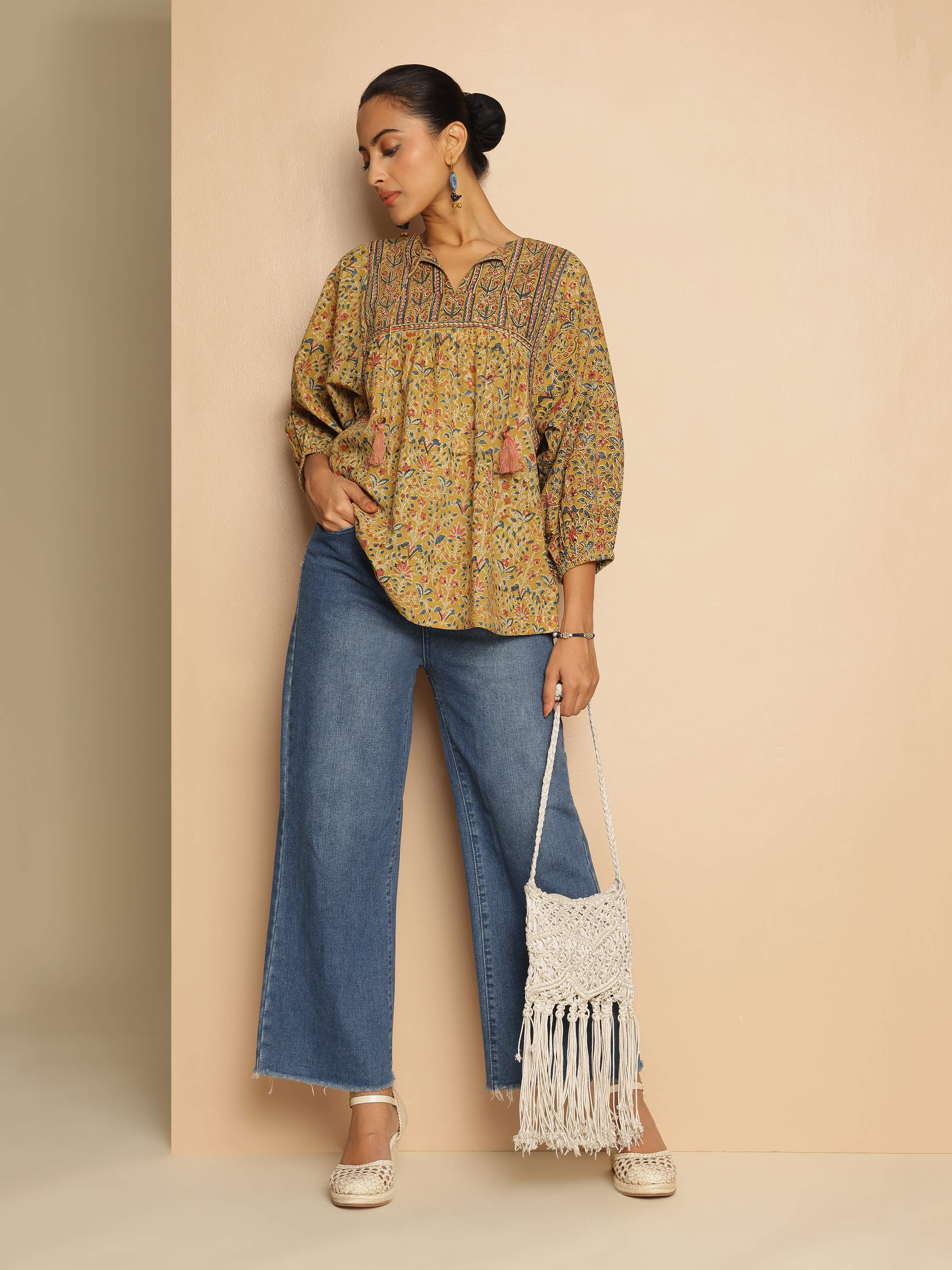 Lifestyle shot that captures the easy-going silhouette and earthy prints.