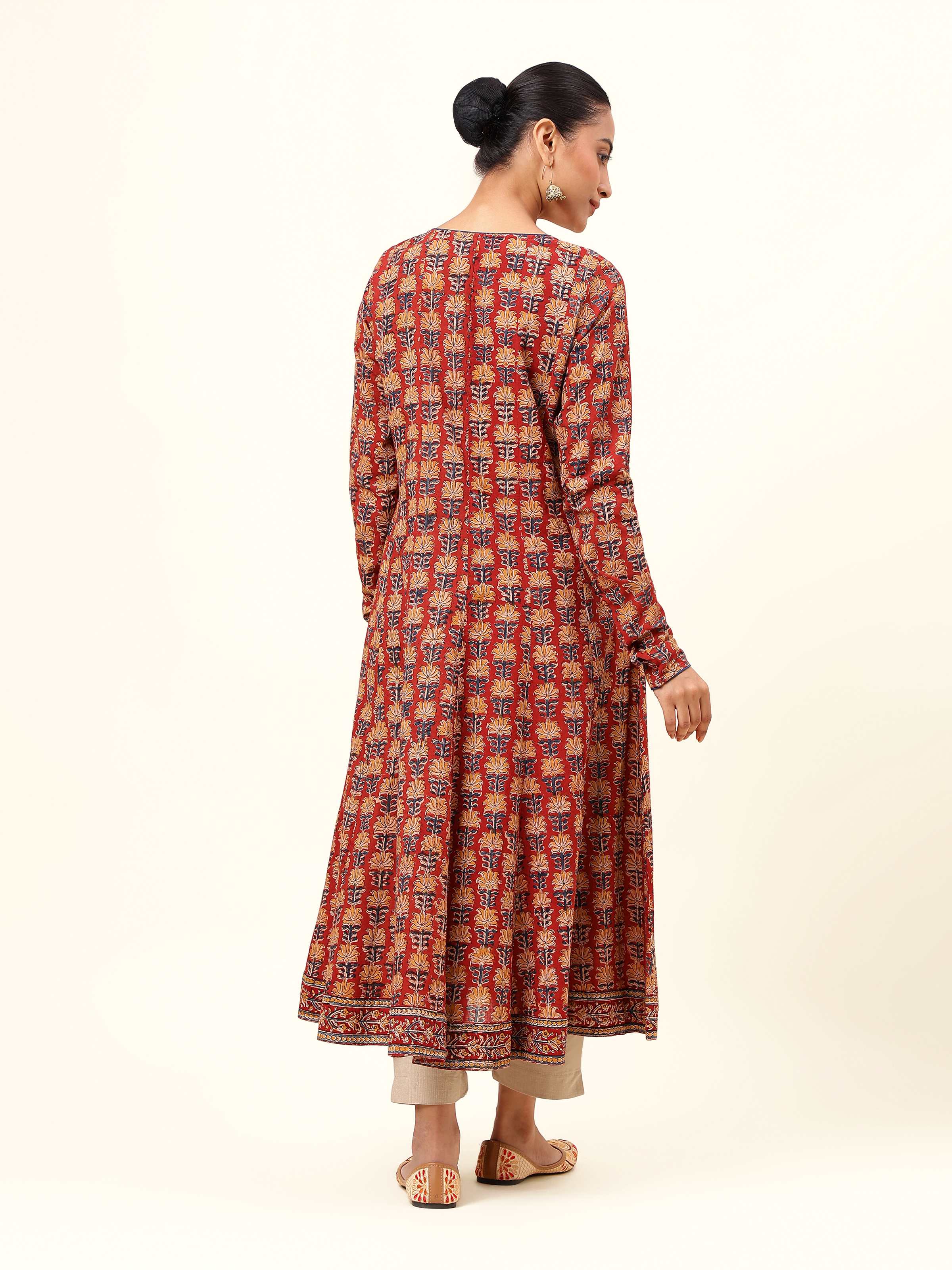 Back view of red cotton Kalamkari block printed kurta featuring yoke detail and fall