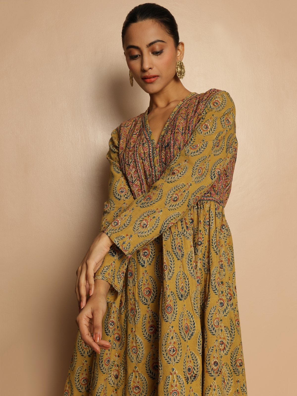 Side view of the yellow block printed cotton kurta showing handcrafted details and relaxed fit.