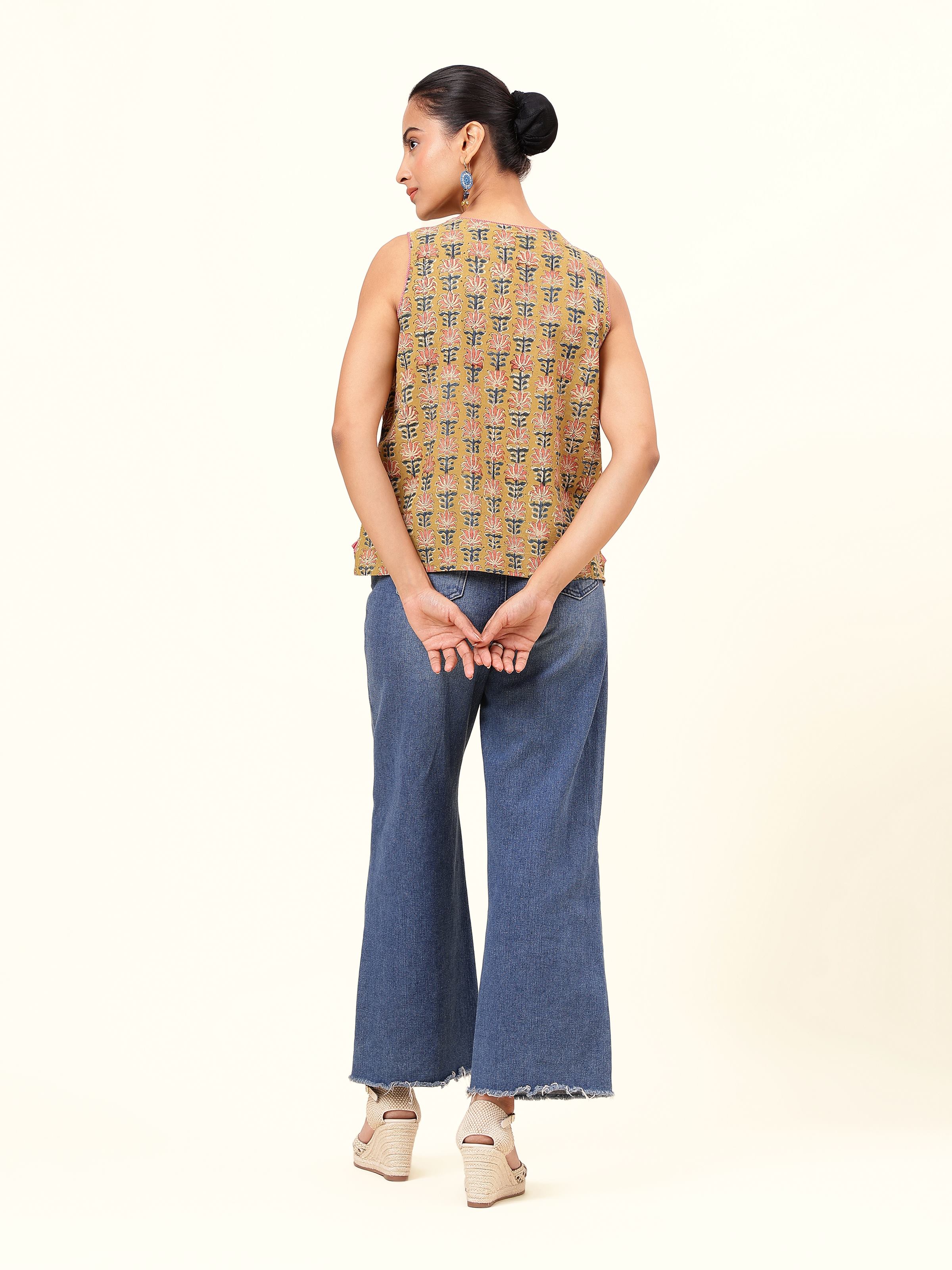 Back view of yellow cotton Kalamkari top showcasing straight hem and neckline cut