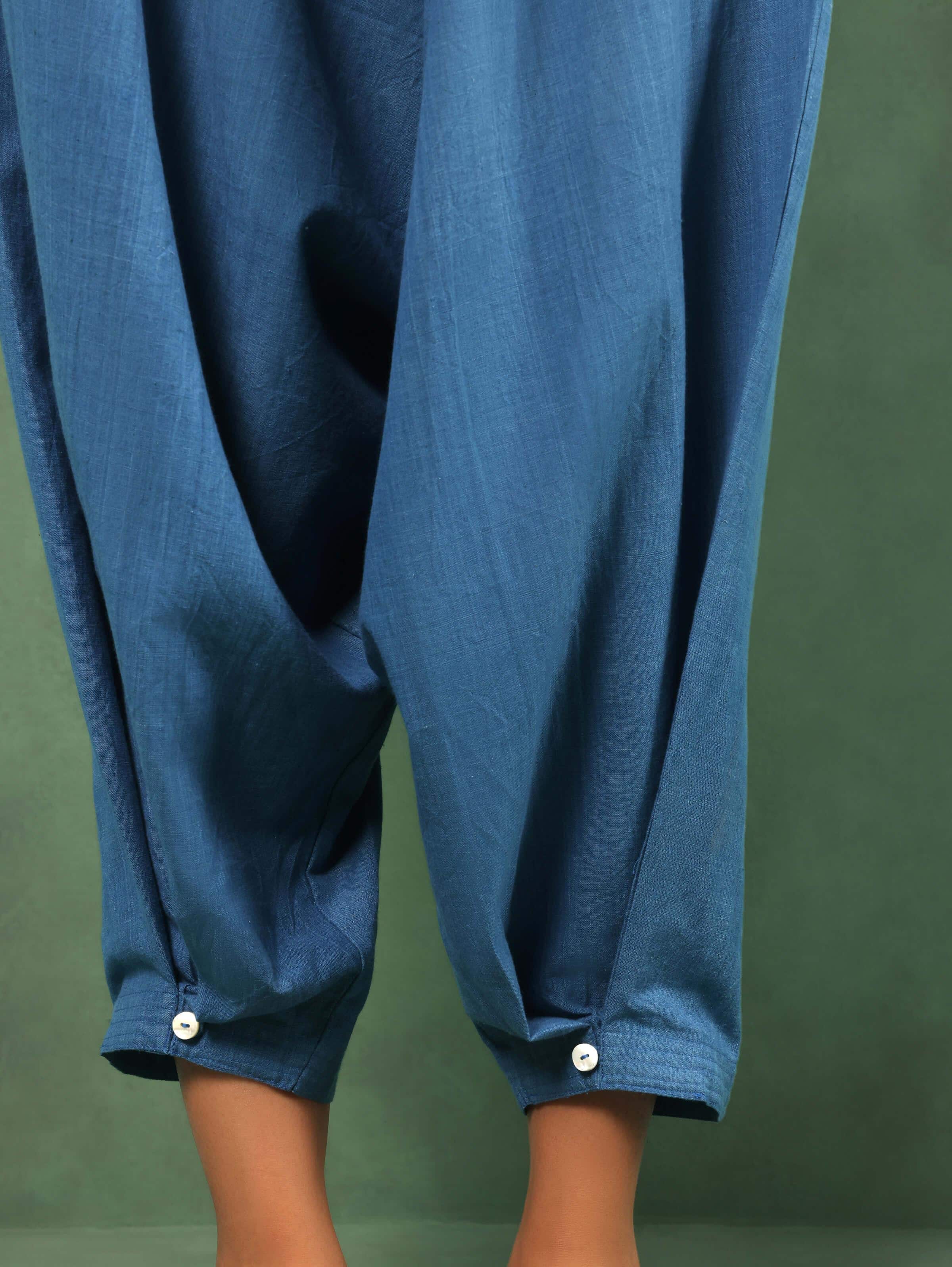 Detail shot showing waistband and handloom weave of indigo cotton harem pants