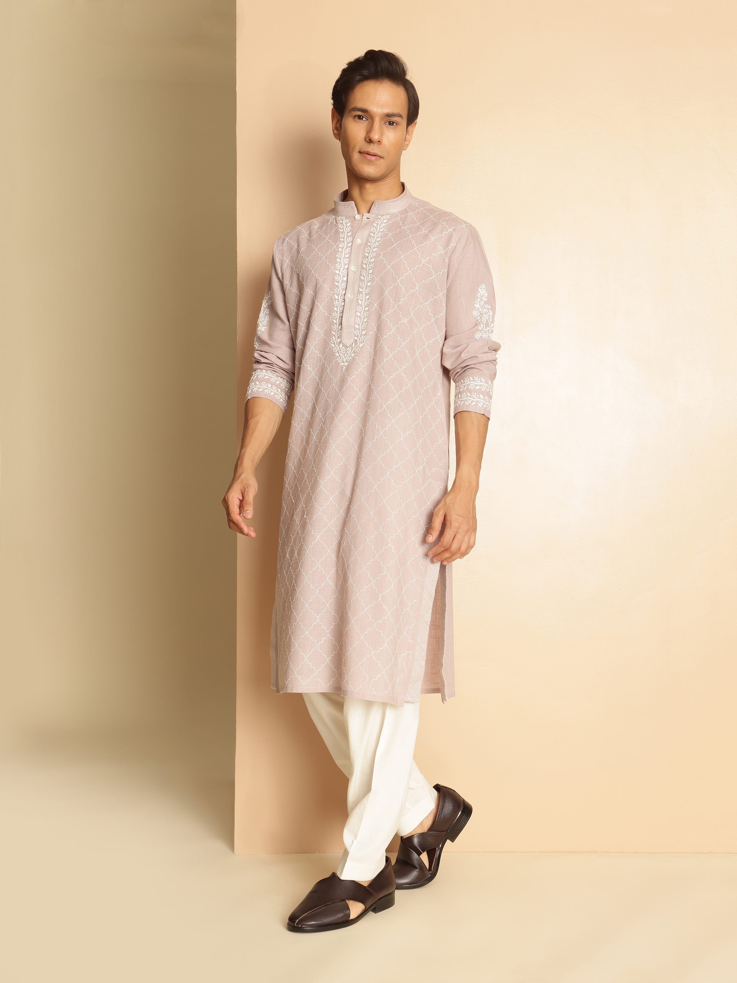 Side view showing graceful fit and traditional Chikankari detailing on soft cotton.