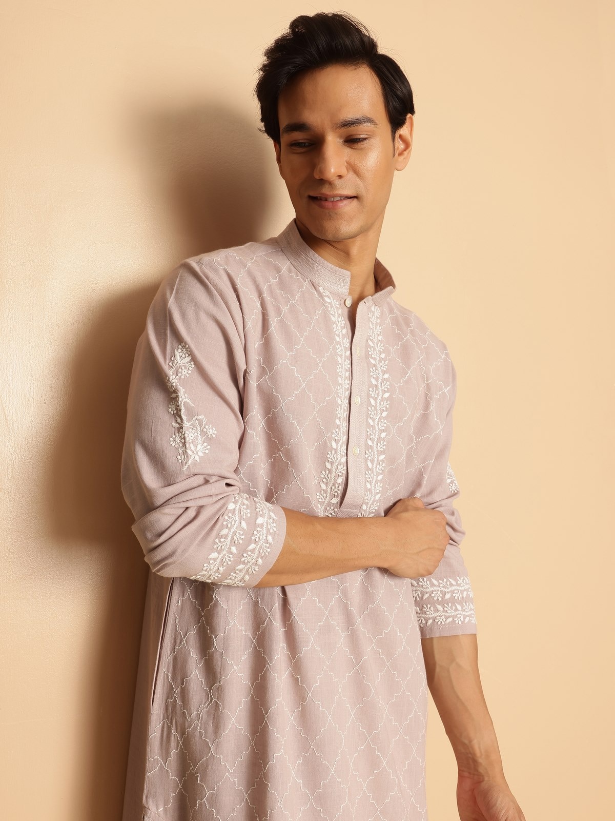 Draped shot of long kurta showcasing neckline embroidery and clean stitch lines.