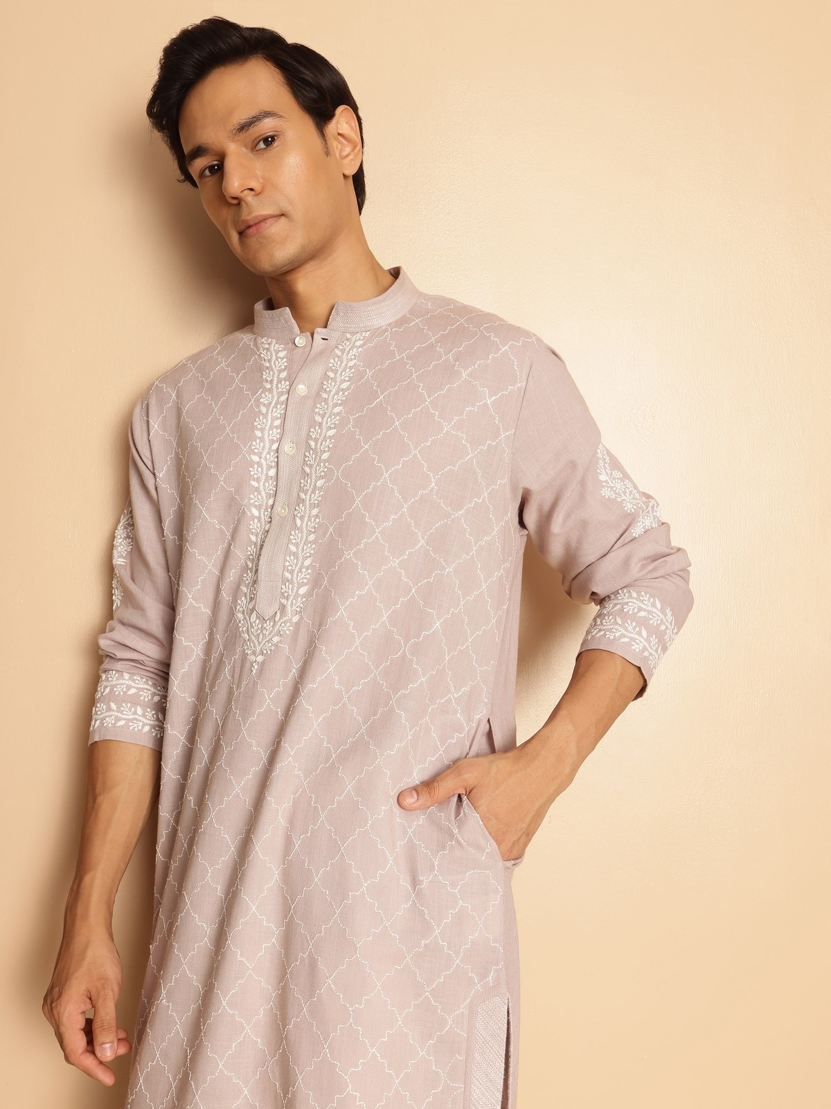 Angled image displaying elegant cut and subtle texture of cotton Chikankari kurta.