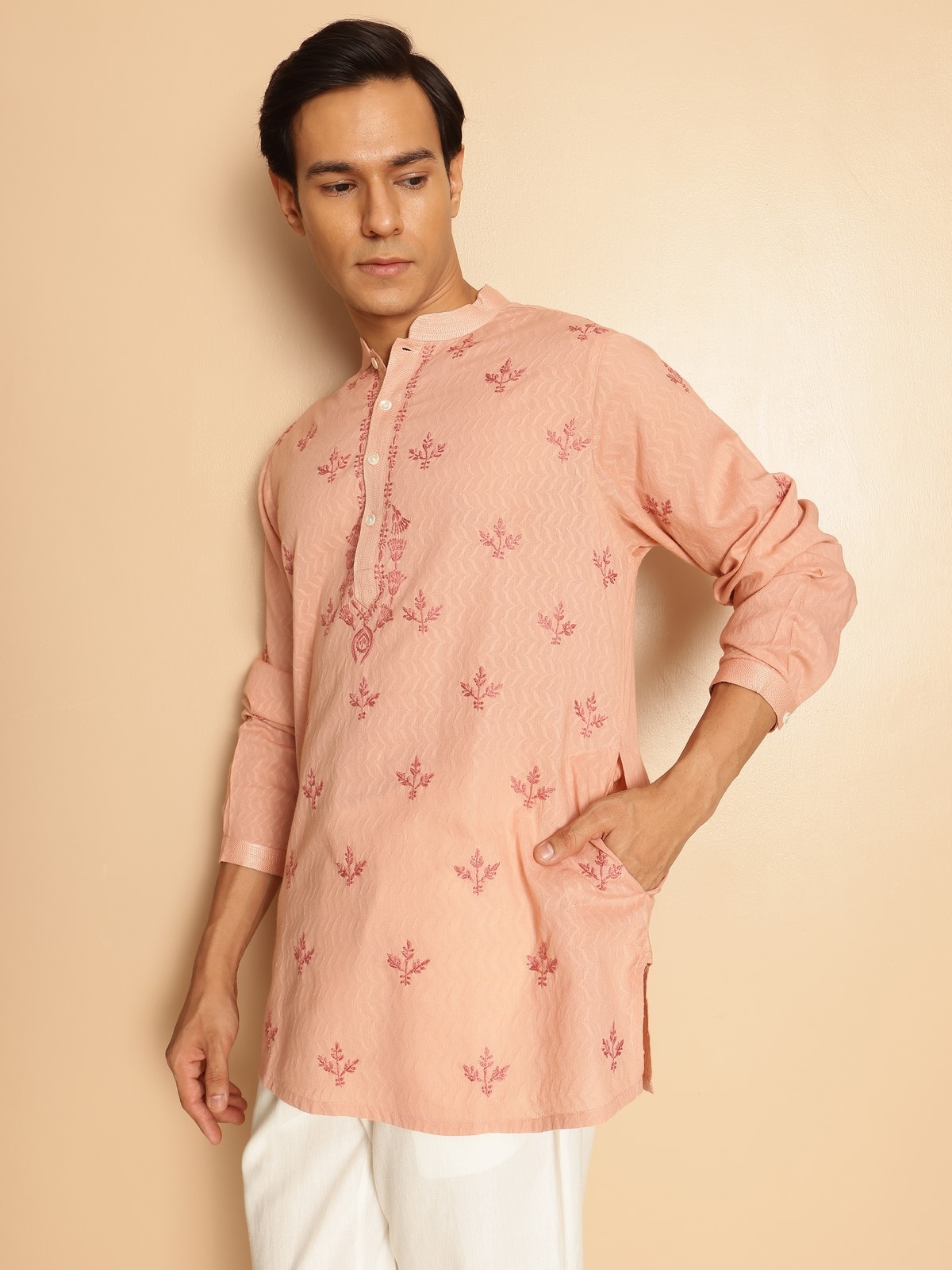 Close-up angle capturing the delicate hand embroidery and subtle texture of the cotton base.