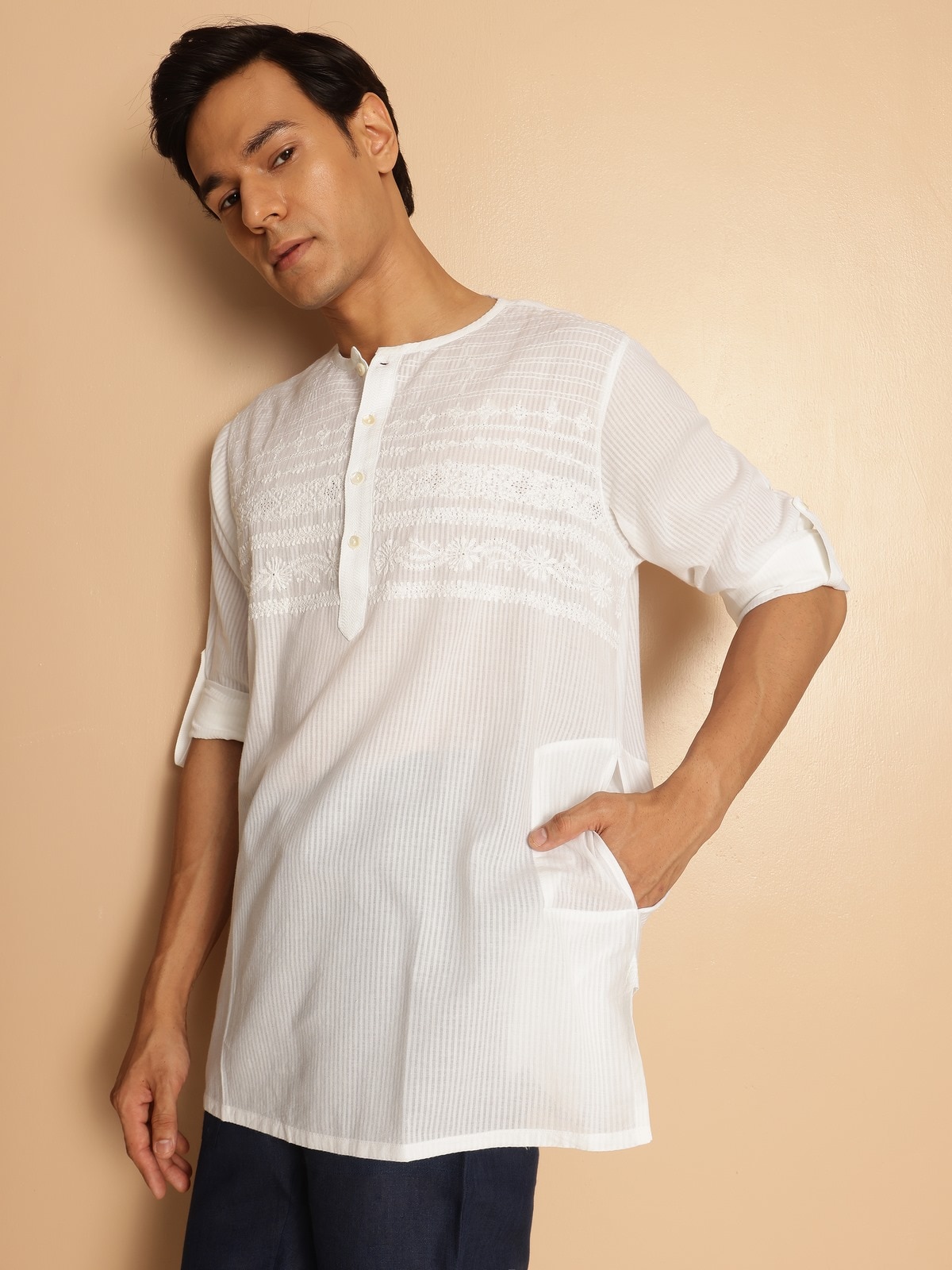 Alternate lifestyle view of white cotton kurta highlighting breezy silhouette and hand embroidery