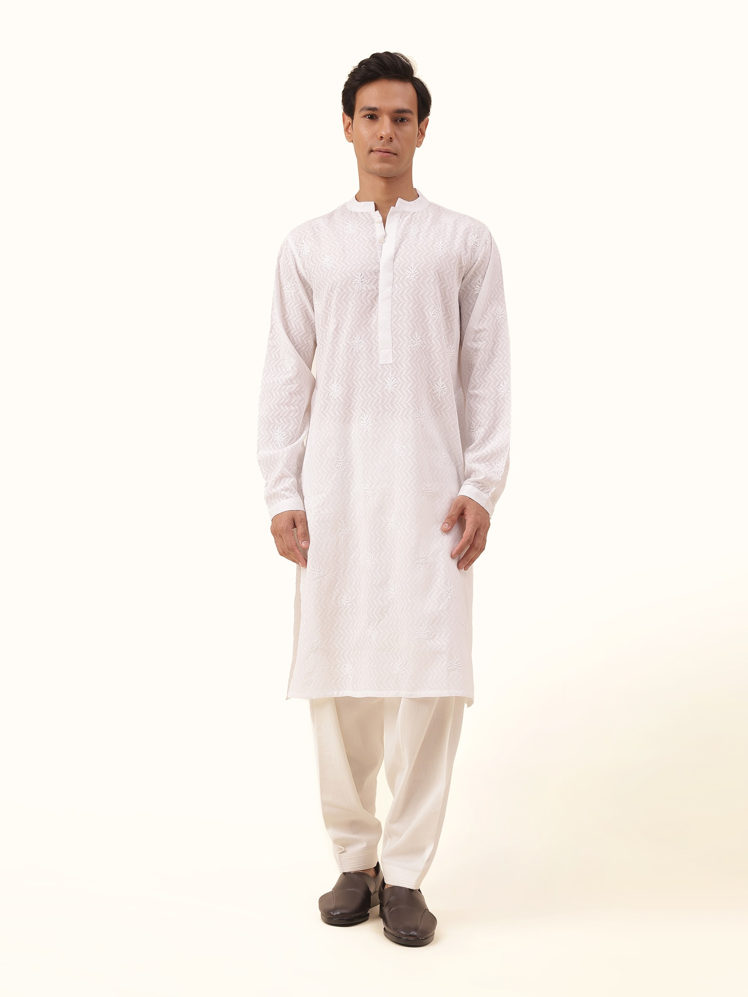 Front view of the white cotton Chikankari long kurta, featuring subtle contrast stitching for a refined, minimalist appeal.