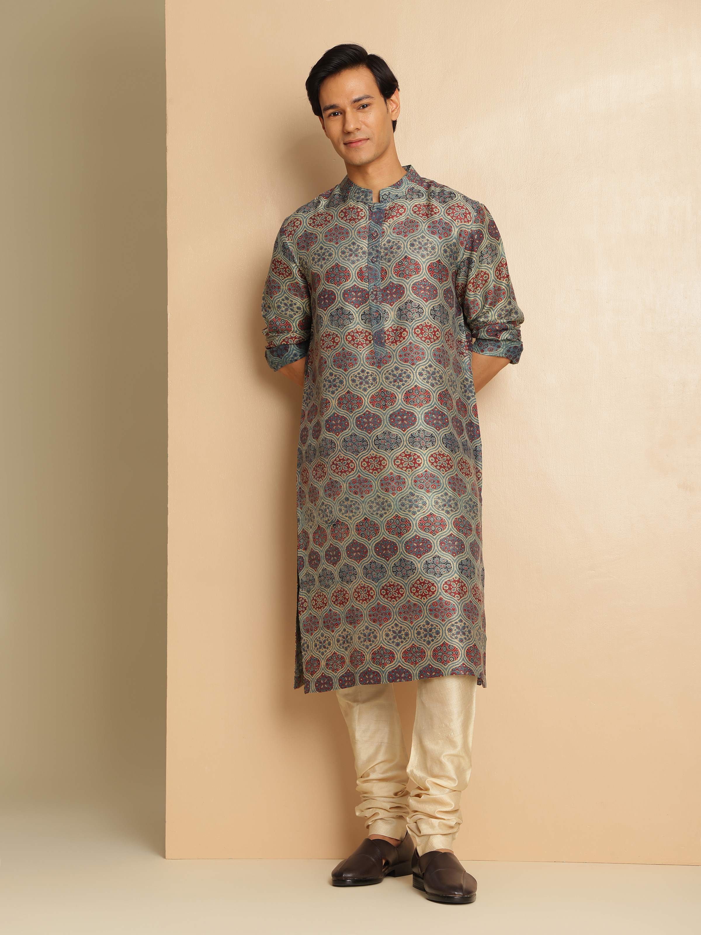 Lifestyle view of indigo silk Ajrakh kurta styled with ethnic pants and accessories.