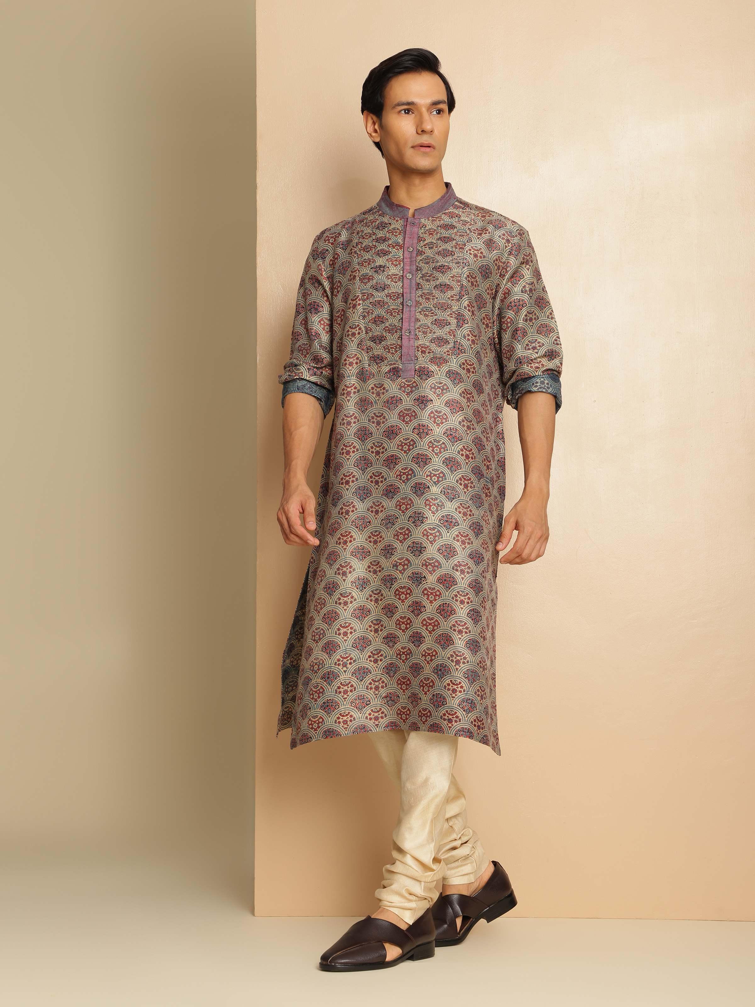 Lifestyle view of Ajrakh printed indigo silk kurta styled with black pants and silver earrings