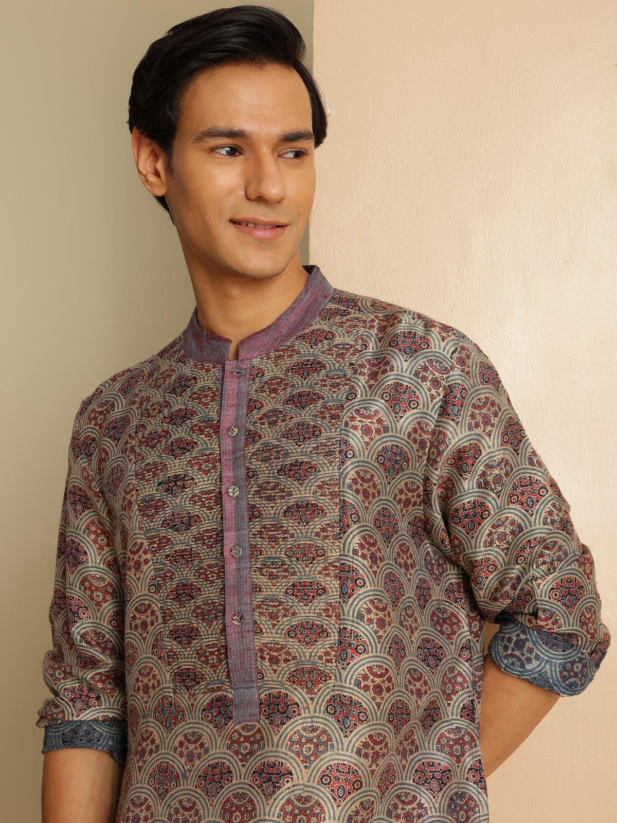 Angled lifestyle view highlighting Ajrakh motifs and silk sheen on indigo kurta
