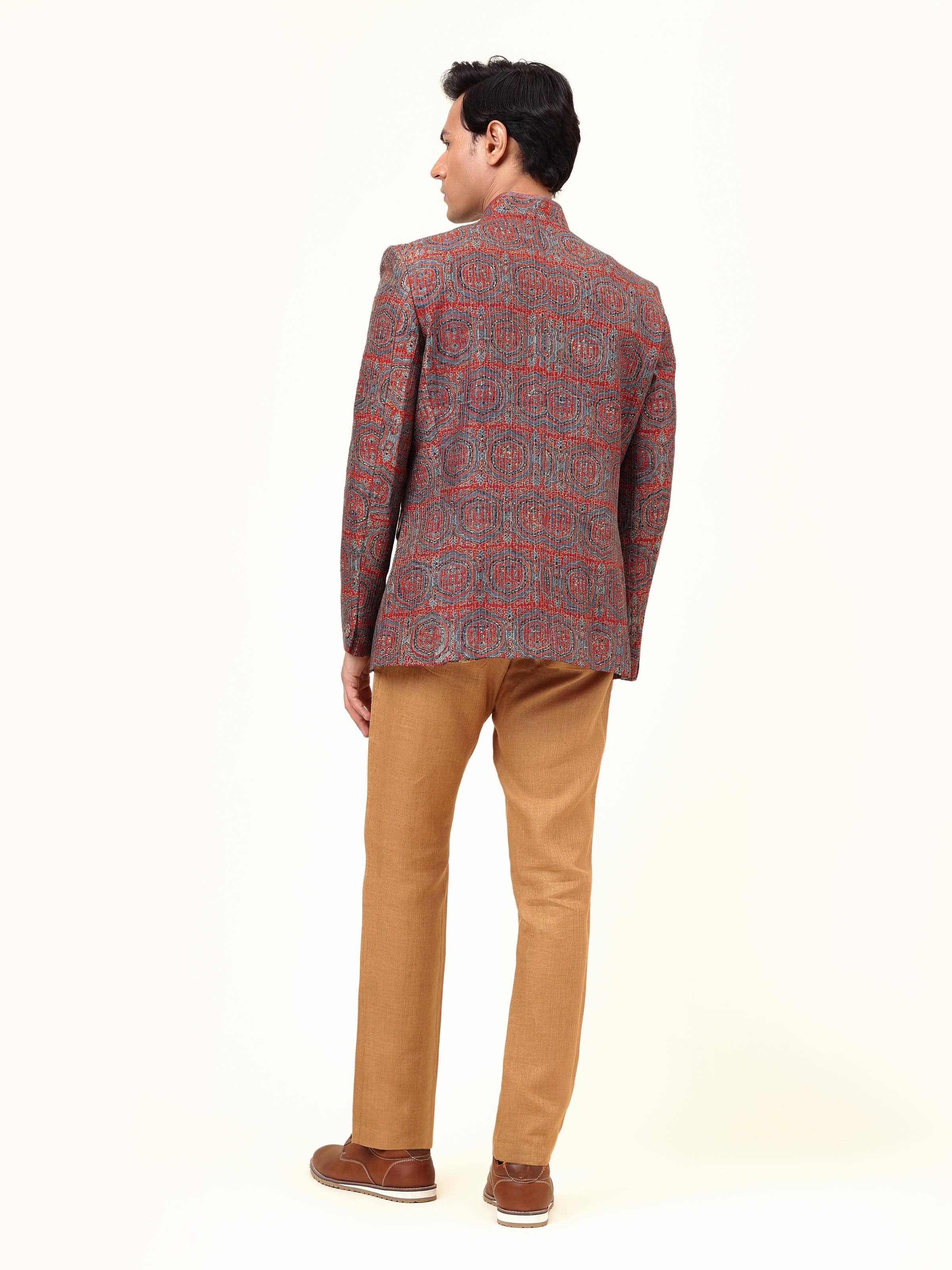 Back view of indigo silk Ajrakh Bandhgala jacket revealing structured tailoring and print continuity