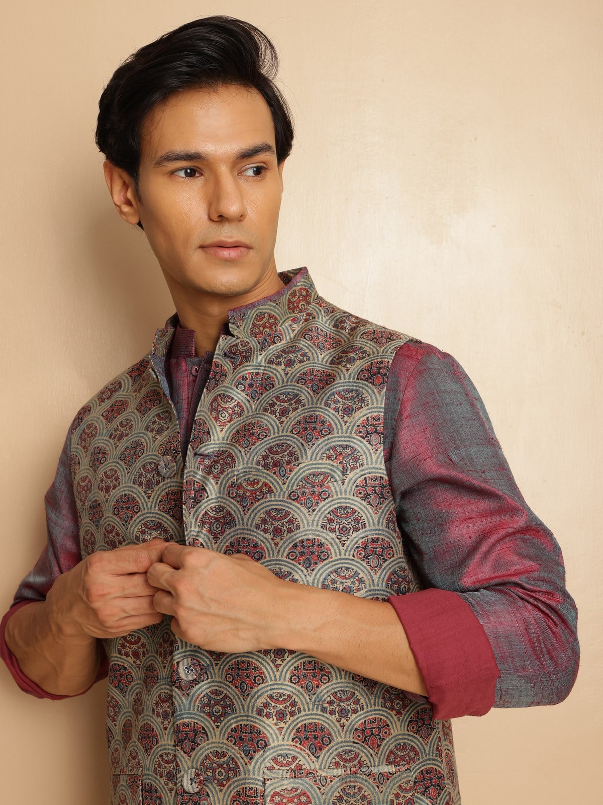 Side view capturing the sleeveless cut and tailored fit of the jacket