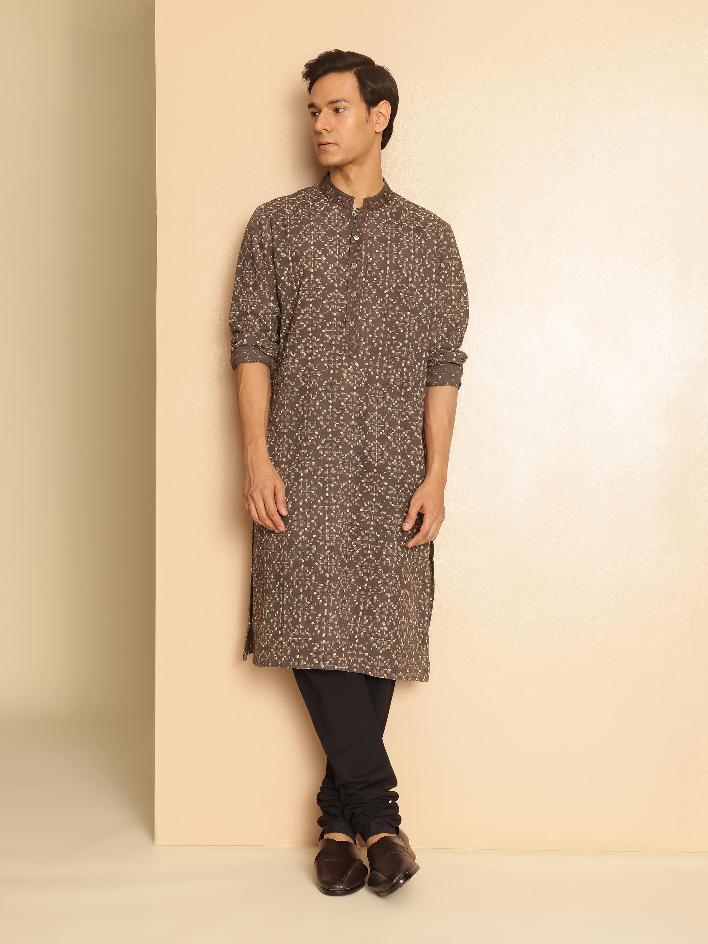Model wearing grey Dabu block printed kurta styled with minimal accessories for a casual ethnic look.