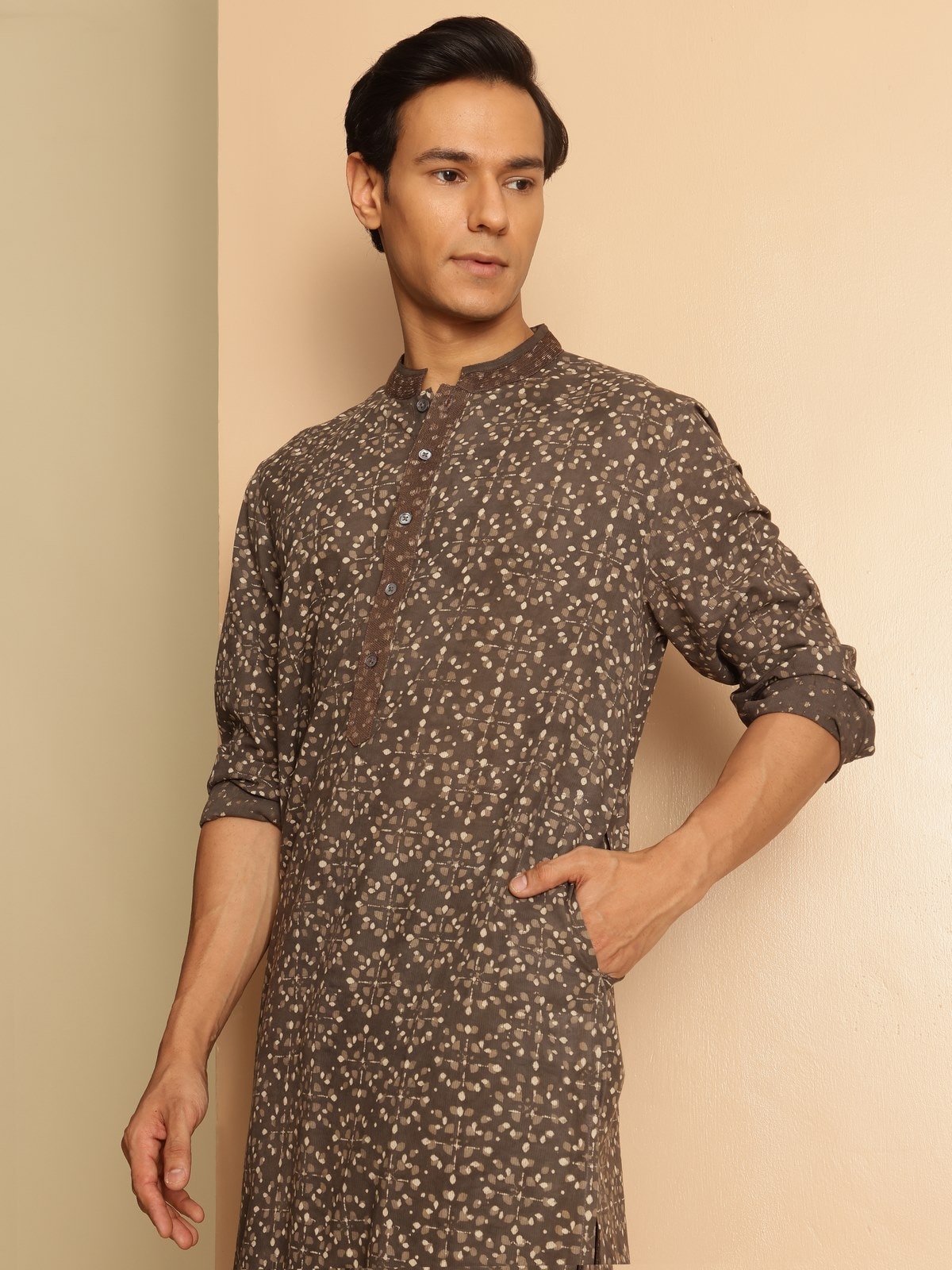 Side view of grey cotton kurta with traditional hand-block Dabu prints, paired with simple bottoms.