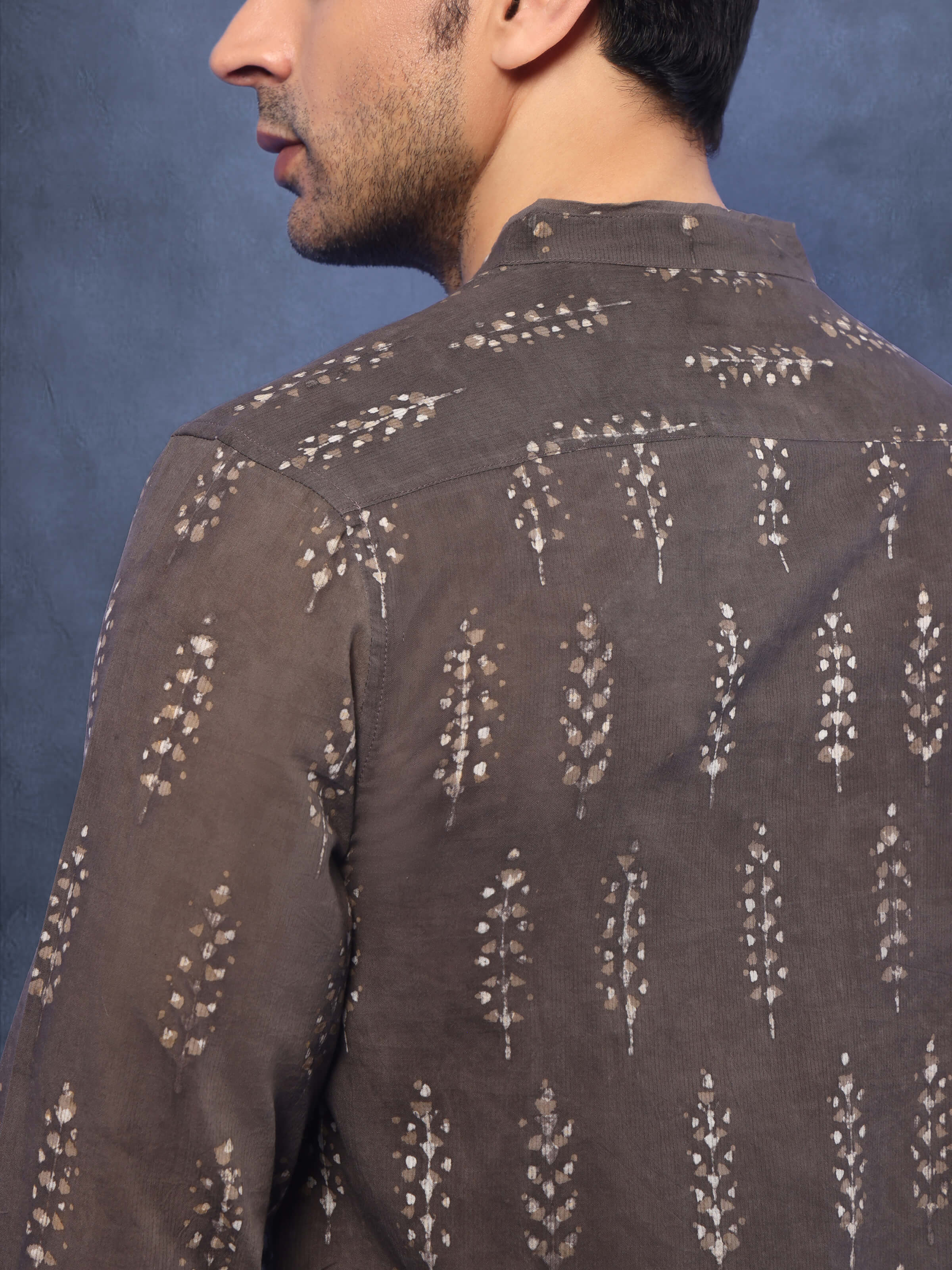 Angled view highlighting kurta’s print and sleeve detail.