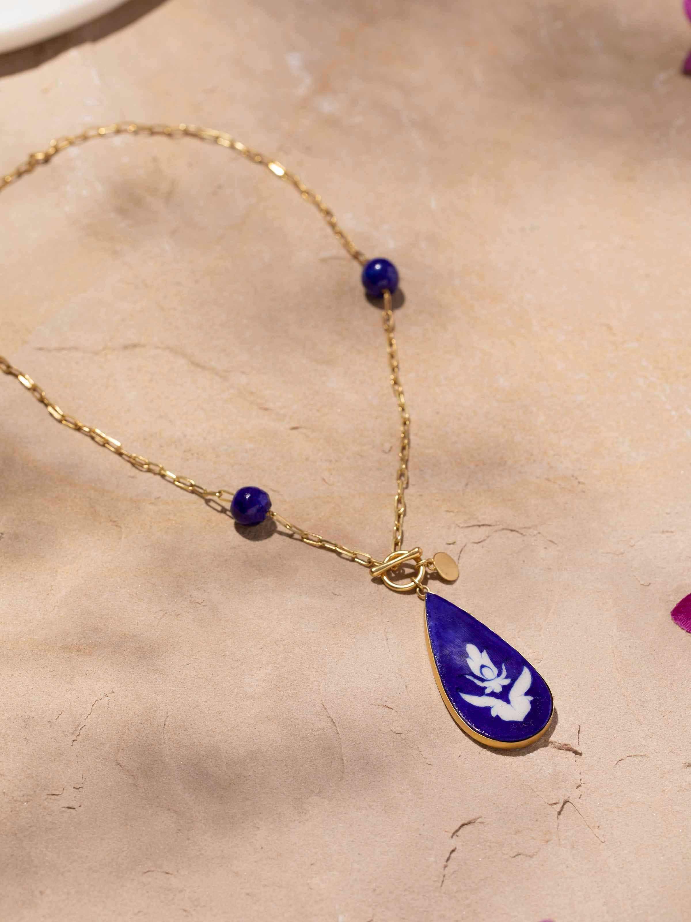 Close-up view of Blue Pottery long necklace emphasizing the intricate patterns and vibrant colors