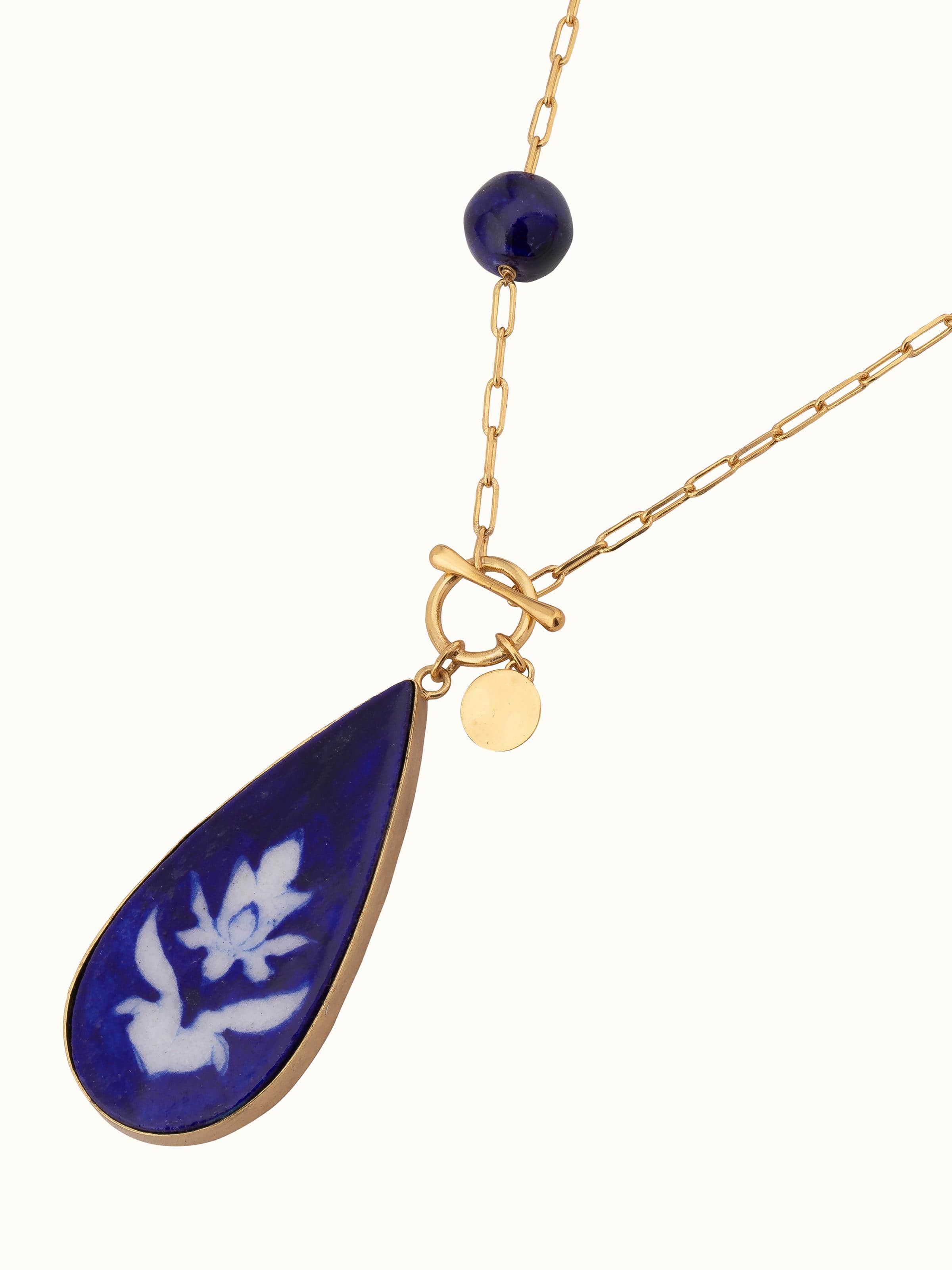 Angled view of Blue Pottery long necklace showcasing its artistic design and colorful elements