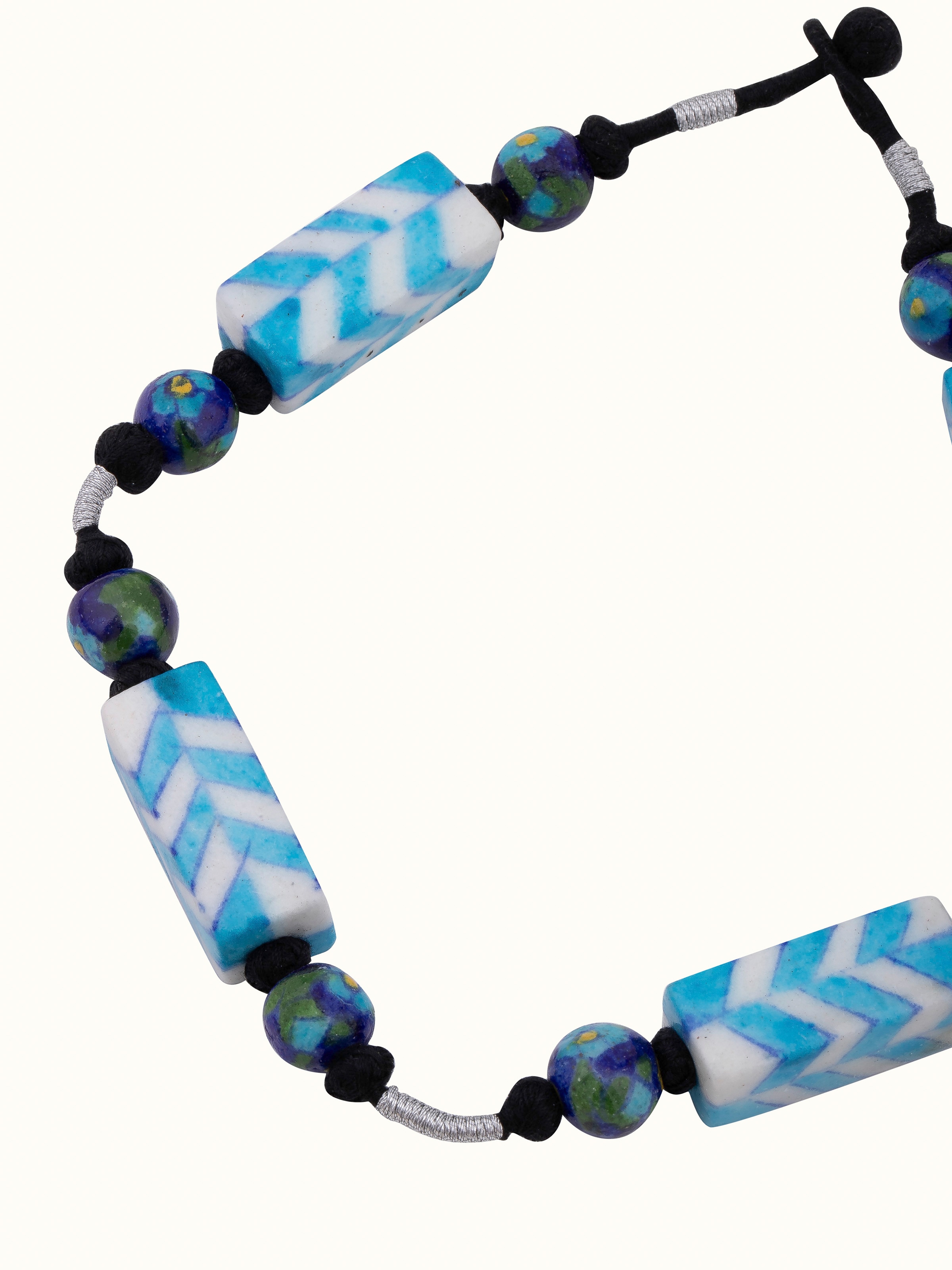 Angled view of Blue Pottery Long Necklace emphasizing the intricate design and colorful pottery elements.
