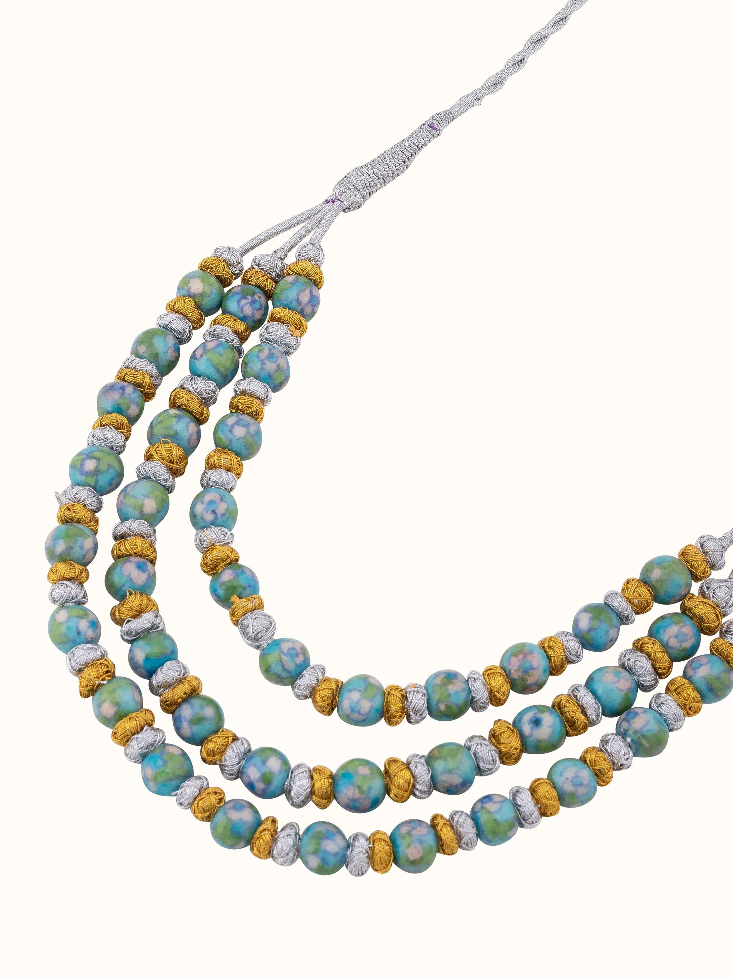 Detailed view of Blue Pottery Long Necklace focusing on intricate blue pottery design and detailing.
