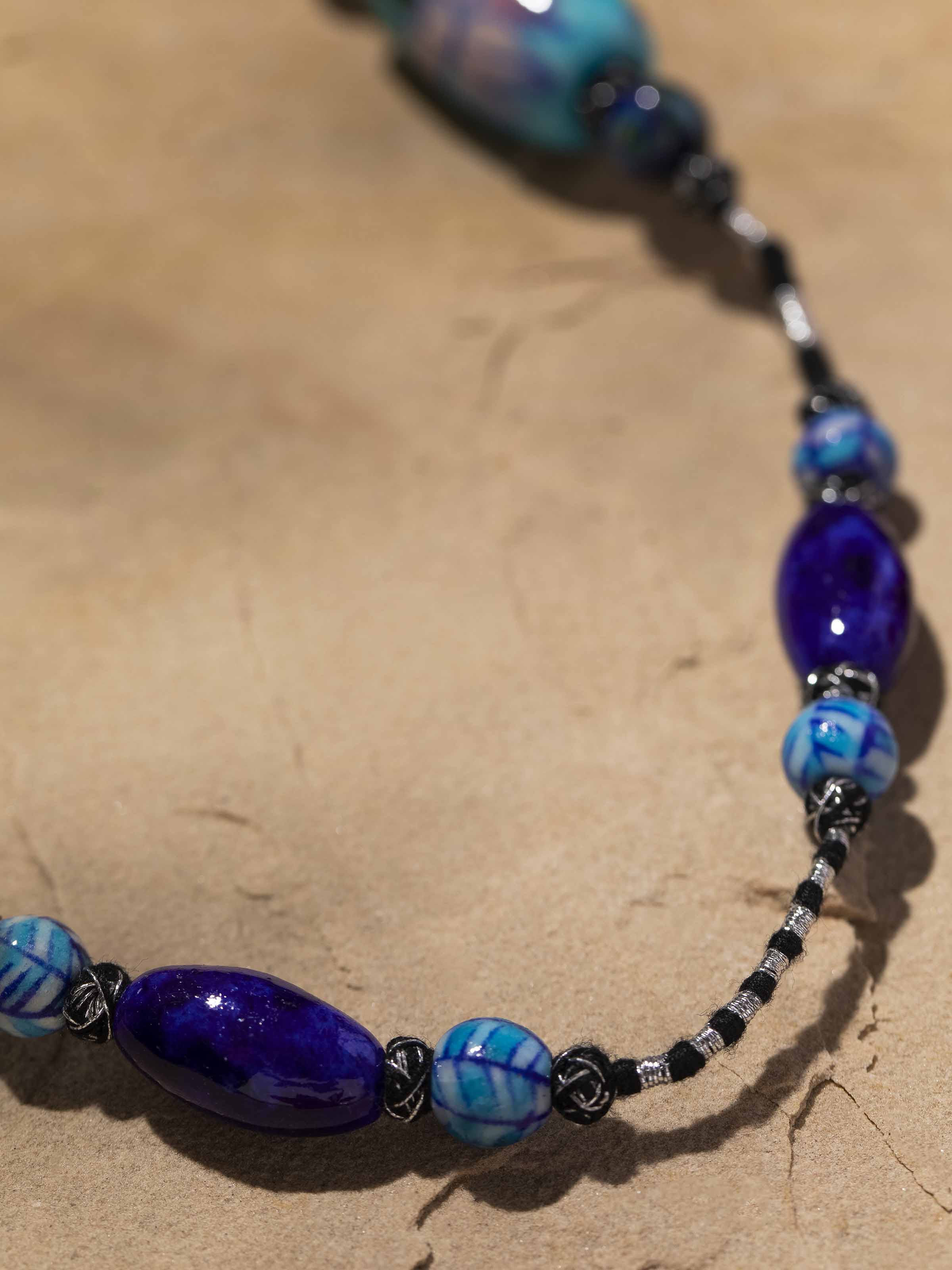 Detailed shot of Blue Pottery Long Necklace emphasizing unique design elements