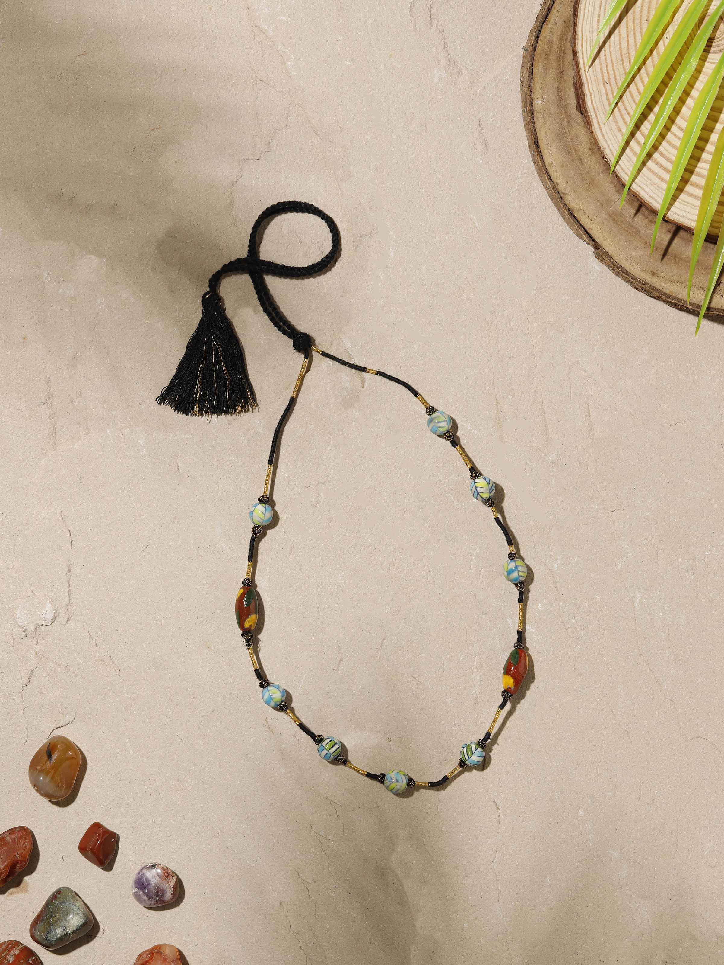 Close-up view of Blue Pottery Long Necklace emphasizing the craftsmanship and detailed blue pottery.