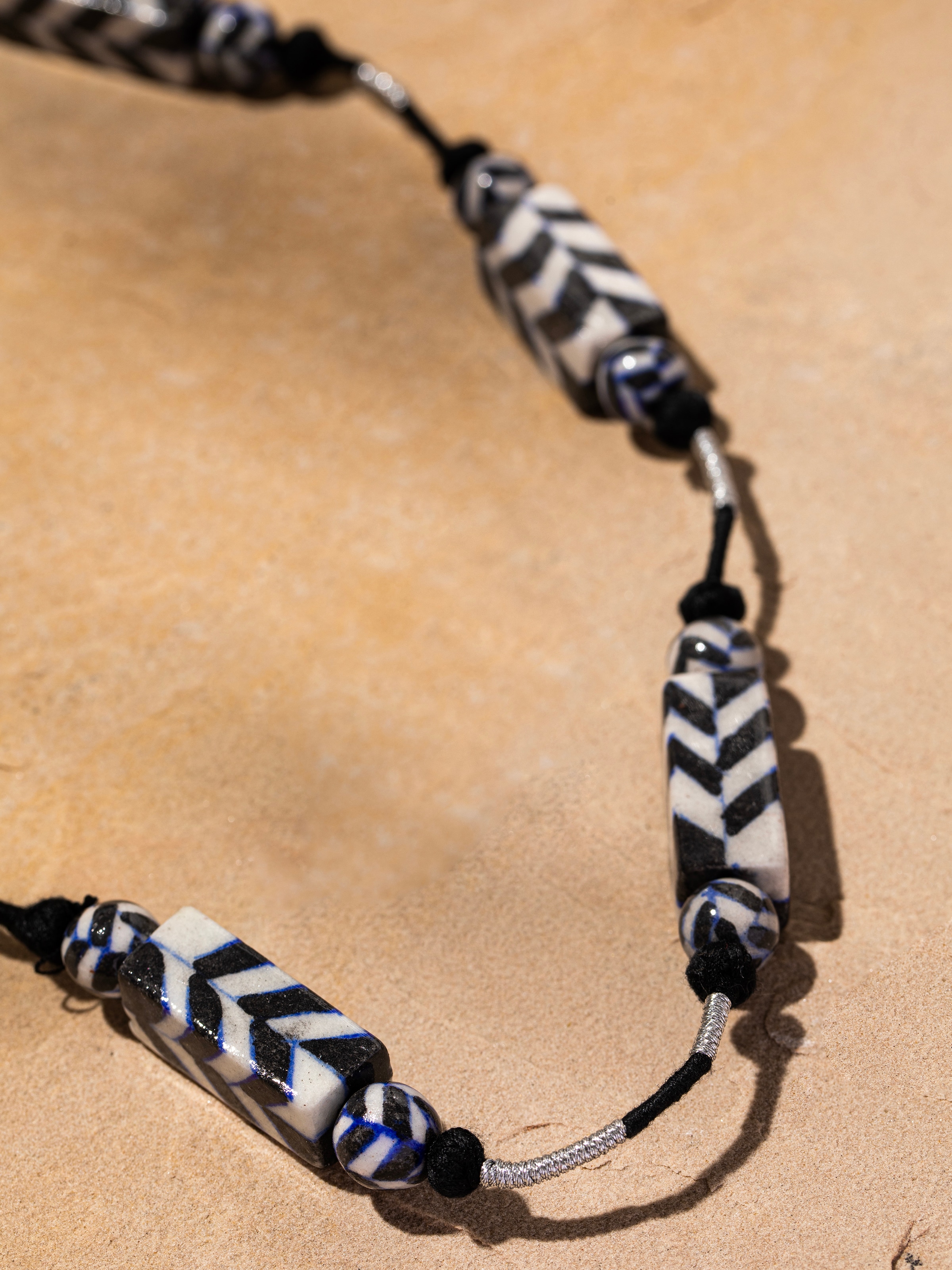 Detailed view of Blue Pottery Long Necklace emphasizing the intricate blue pottery craftsmanship and bead details.