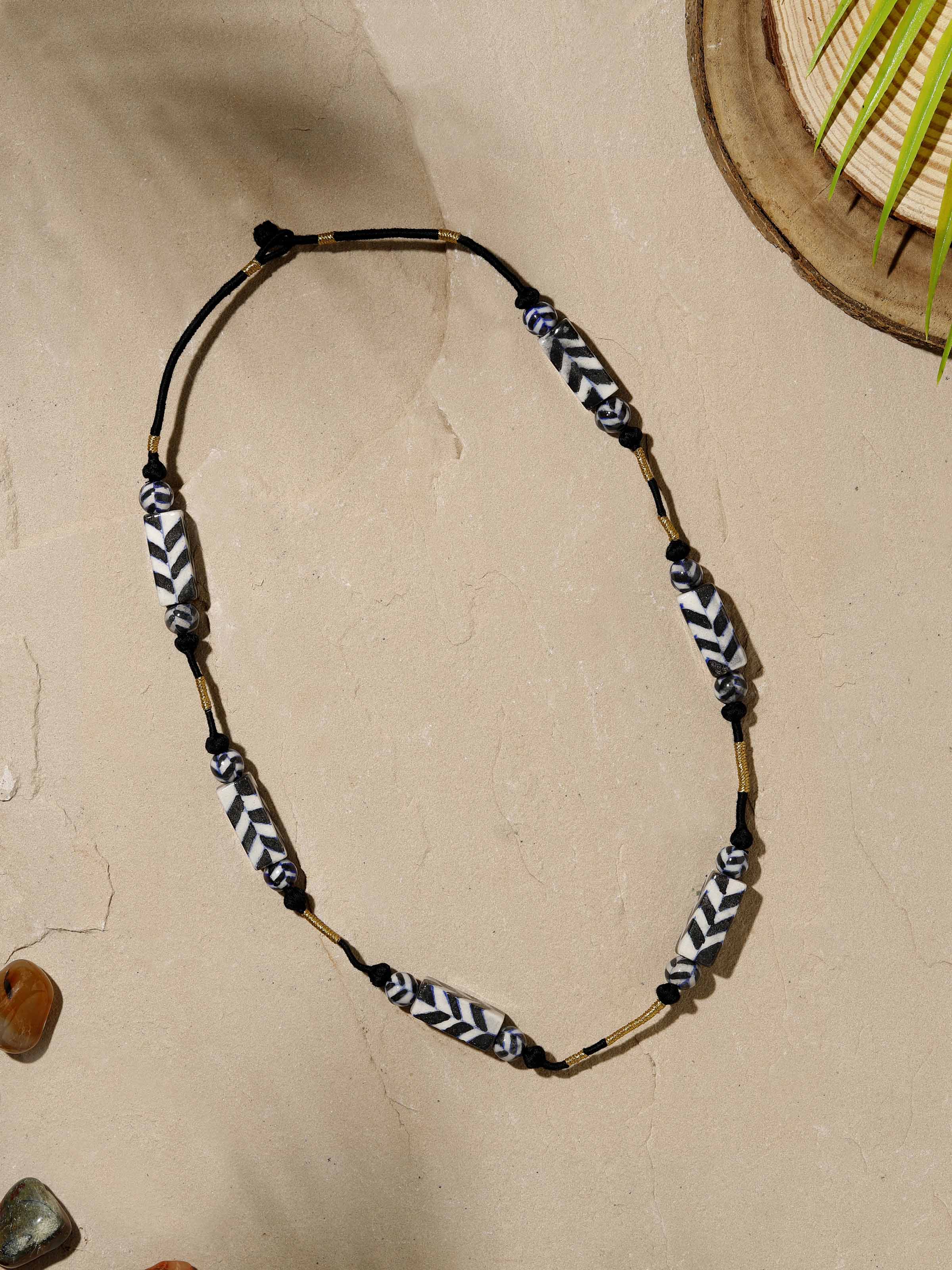 Close-up view of Blue pottery long necklace focusing on its detailed ceramic design and artistic finish